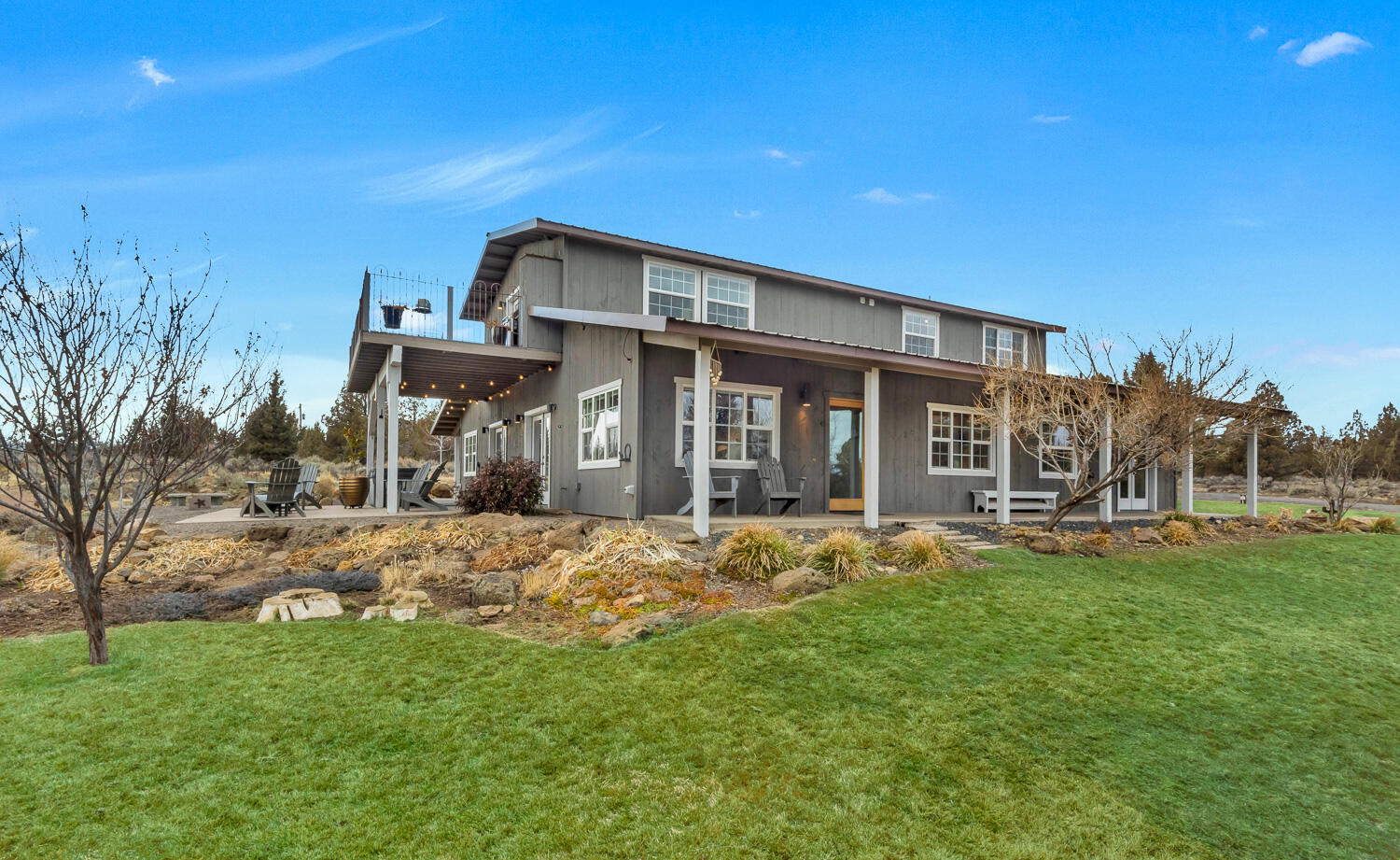 Beautiful, artistic country haven on 8.8 acres with views of the Cascade Mountains and Smith Rock! The unique Barn-style exterior features post and beam construction, revealing modern, creative & flexible architecture that leads to multiple outdoor spaces overlooking the High Desert landscape. The open floor plan features concrete floors w/radiant heat, blue buggy pine ceilings, stainless steel appliances, 2 gas fireplaces, walls of windows, huge walk-in closet in primary bedroom, oversized & heated garage, metal roofing, & built-in sound. Uniquely & cleverly designed for minimal maintenance. Lots of space to park your RV, Sprinter van or other toys! The perfect home for those looking for a private Central Oregon oasis conveniently located between Bend and Sisters. Move in ready!