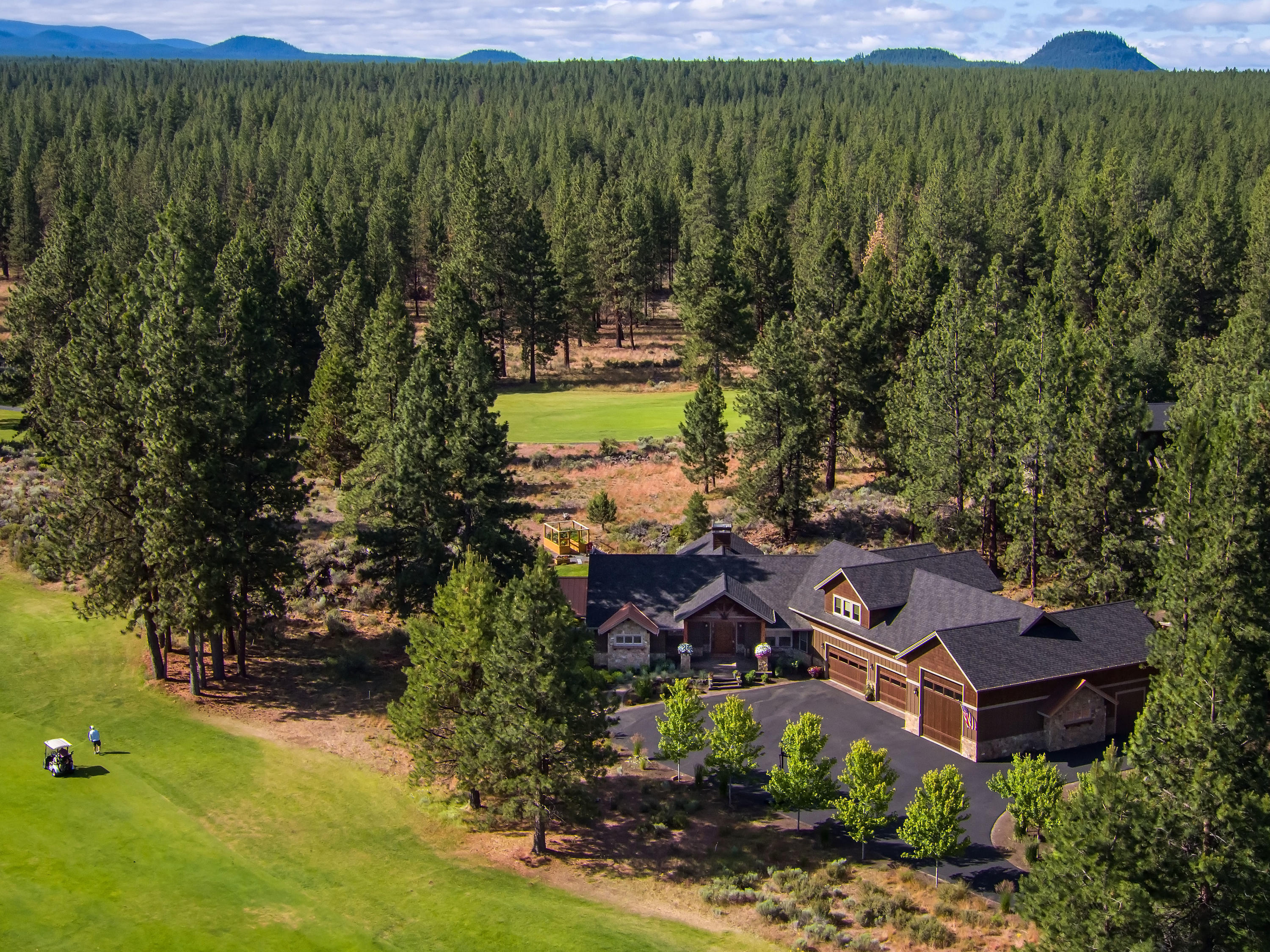 Stunning NW Style home on a large 1.31 acre private lot backing common area in Sunset View Estates on the Lost Tracks Golf Course. Custom Home is 3663 sq ft, 4 bedrooms, 3.5 bathrooms, main floor living with open floor plan, gourmet kitchen, granite counter tops, island, dining area and living room with stone gas fireplace. Master Suite with beam accents, fire place, tile shower and private hot tub on a covered patio on main level, guest suite on the main and 2 guest bedrooms upstairs. Attached 4 car garage with work benches and attached RV garage with 1/2 bathroom and workshop. The outdoor setting is wonderful including: kitchen with BBQ, covered patio, fireplace, waterfall feature, fenced garden, beautiful landscape in the pine trees. Seller needs to lease back until June 1, 2021. Wonderful opportunity to enjoy the Central Oregon lifestyle minutes from Bend.