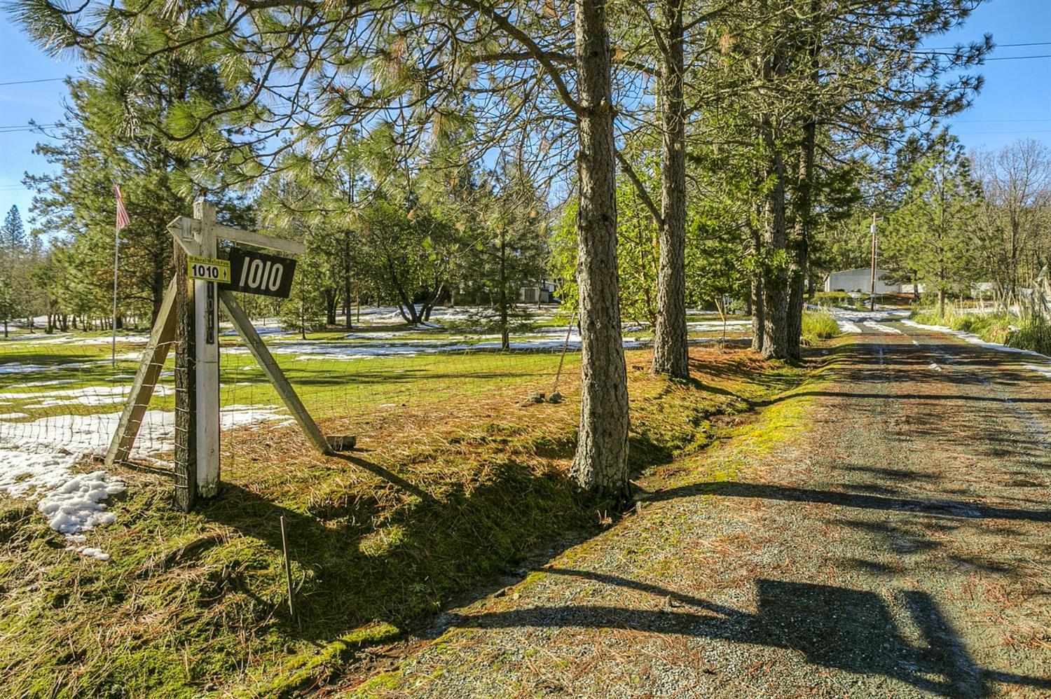 3 tax lots (2 buildable parcels) all zoned RR5 totaling 7.27 acres of gorgeous usable mix of forest & pasture. The first parcel (tax lot #1312), known as 1010 Saratoga Way, has an immaculate 3 bedroom, 2 bath, 1772 sf manufactured home built in 1999 on concrete block foundation, with a private well, septic & access to a nice detached 2-car carport. The second parcel (tax lots 2600 & 105), known as 976 Saratoga Way, has a large building pad, a second private well & septic. A tenant owned manufactured home is currently leasing this pad for $350/month with a written lease. Property also has a 900 sf shop with power, air lines including compressor & new roof & sky lights. Several sheds and partial fencing. Excellent properties for animals. Less than 10 minutes to town. Property taxes shown is a total for all 3 tax lots of $1,389.82.