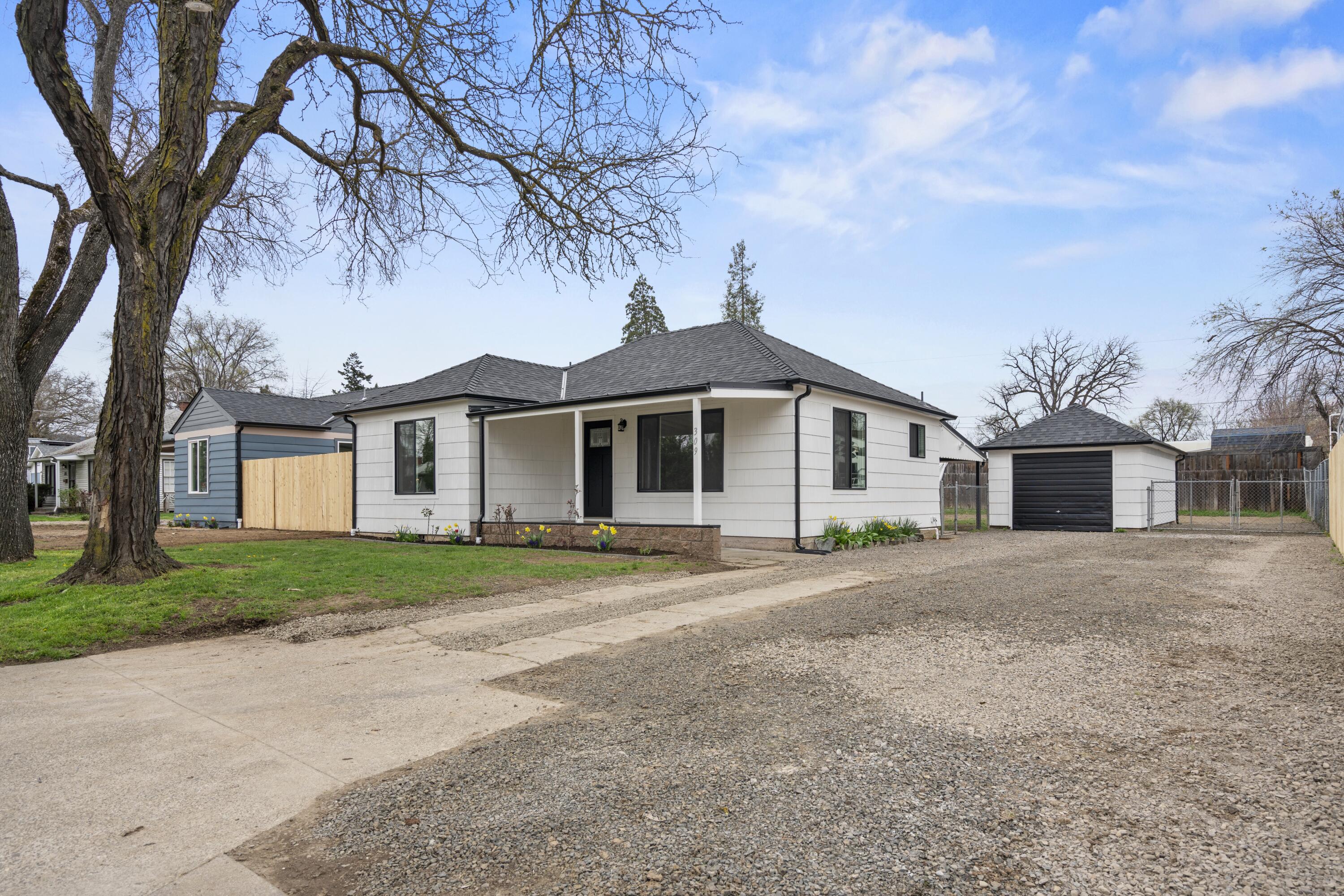 Charming and fully updated 1928 bungalow! This 2-bedroom, 1-bath home blends vintage character with modern convenience. Featuring 840 sq. ft. of thoughtfully designed space, it boasts beautiful hardwood and new LVP flooring. Fully renovated, upgrades include a brand-new roof, energy-efficient windows, fresh interior and exterior paint, and a heat pump for year-round comfort. The renovated kitchen and bathroom shine with stylish finishes, while updated electrical and plumbing add modern efficiency. Classic cedar shingle siding enhances the home's timeless appeal. Situated on a large and fully fenced lot, this property offers ample parking and a detached garage, providing plenty of storage or workspace. Move-in ready with new appliances and a well-maintained layout, this home is a fantastic opportunity!