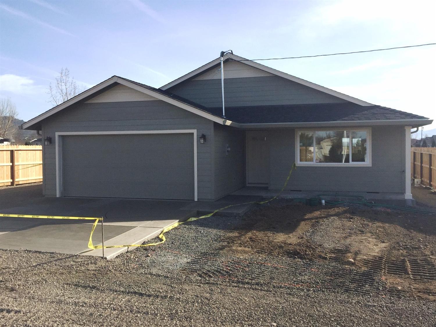 Beautiful Brand New Custom-Built Single Level Home, Built with Pride by Richard T. Brink Homebuilders, Inc! Tons of upgrades throughout the entire home. Excellent open floor plan with vaulted ceilings, huge living room with ceiling fan, covered front and back porch, large kitchen with slider to back yard, huge RV parking plus much more. This home features custom cabinets throughout, granite countertops, approximately 1000 sq. ft. of upgraded laminate flooring, upgraded stainless-steel appliances & upgraded carpet in all bedrooms. Nice sized master suite features a walk-in closet and a walk-in shower. Outside, enjoy entertaining in the completely landscaped front and back yards with timed sprinklers. Completely fenced back yard & a finished 2-car garage. This is A Must Tour.