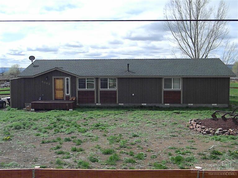 Small irrigated property close to town. This home has been extensively remodeled, with vaulted ceilings in the great room, it has an updated kitchen with pine cabinets. The Master bedroom has large walk-in closet Property is fenced and ready for your horses or livestock.