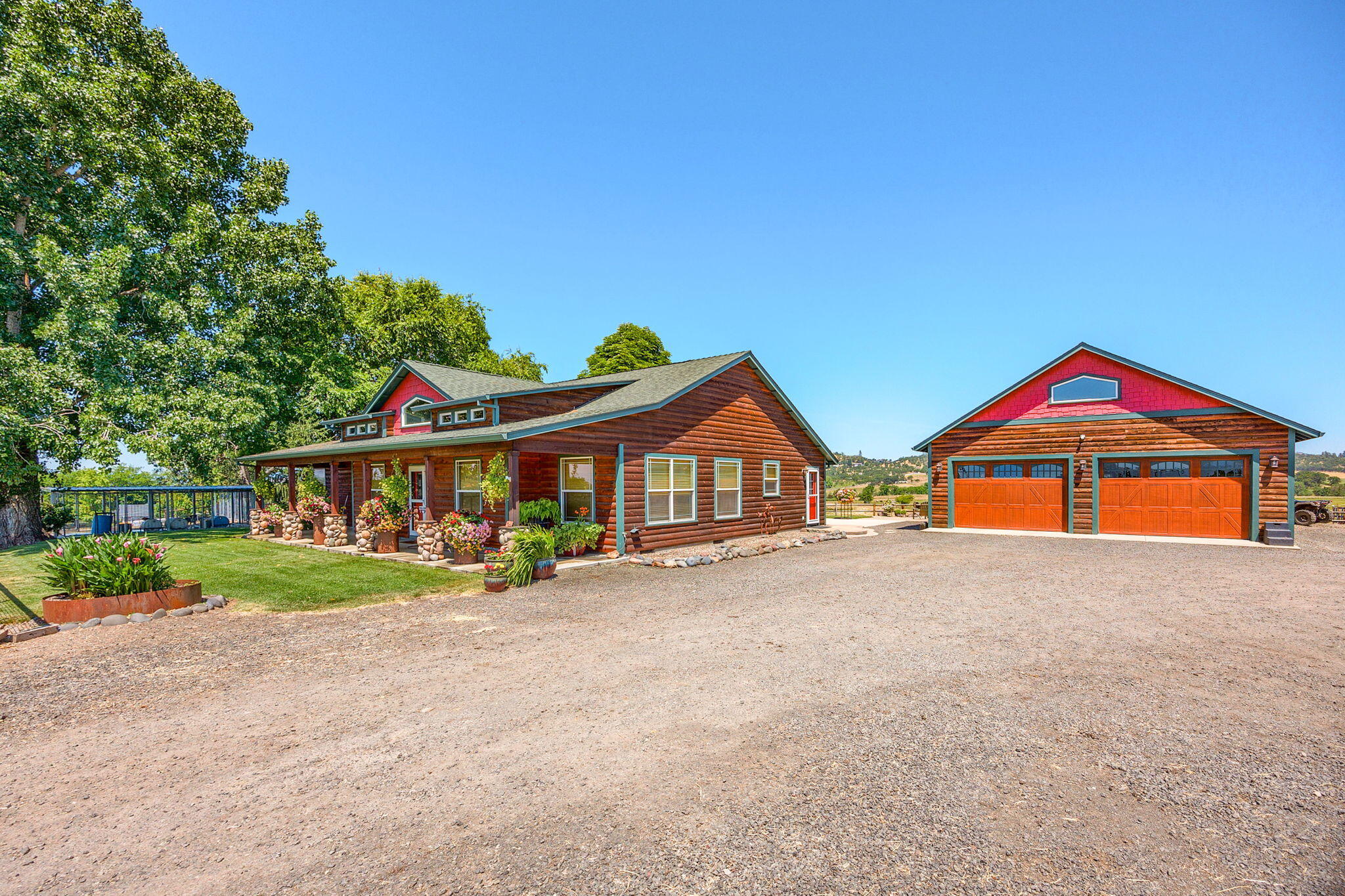 Situated on 30 sprawling acres in the scenic outskirts of Eagle Point, this exquisite  ranch offers a blend of luxury and functionality. Zoned EFU (Exclusive Farm Use) and spanning three parcels, the property features a meticulously crafted 2111 sq.ft. farmhouse, boasting 3 bedrooms and 2.5 bathrooms. The home is a showcase of custom design, highlighted by hand-scraped hickory floors, granite countertops, and an elegant master en-suite complete with a jacuzzi tub. The ranch includes a hay barn, two ponds and a well-appointed outdoor arena. Natural beauty abounds with two ponds and breathtaking views of Mt. McLaughlin, adding to the allure of the setting. Practical amenities such as 3-phase power enhance the property's versatility and functionality. This rare offering provides an unparalleled opportunity to enjoy a luxurious lifestyle amidst Oregon's natural splendor.