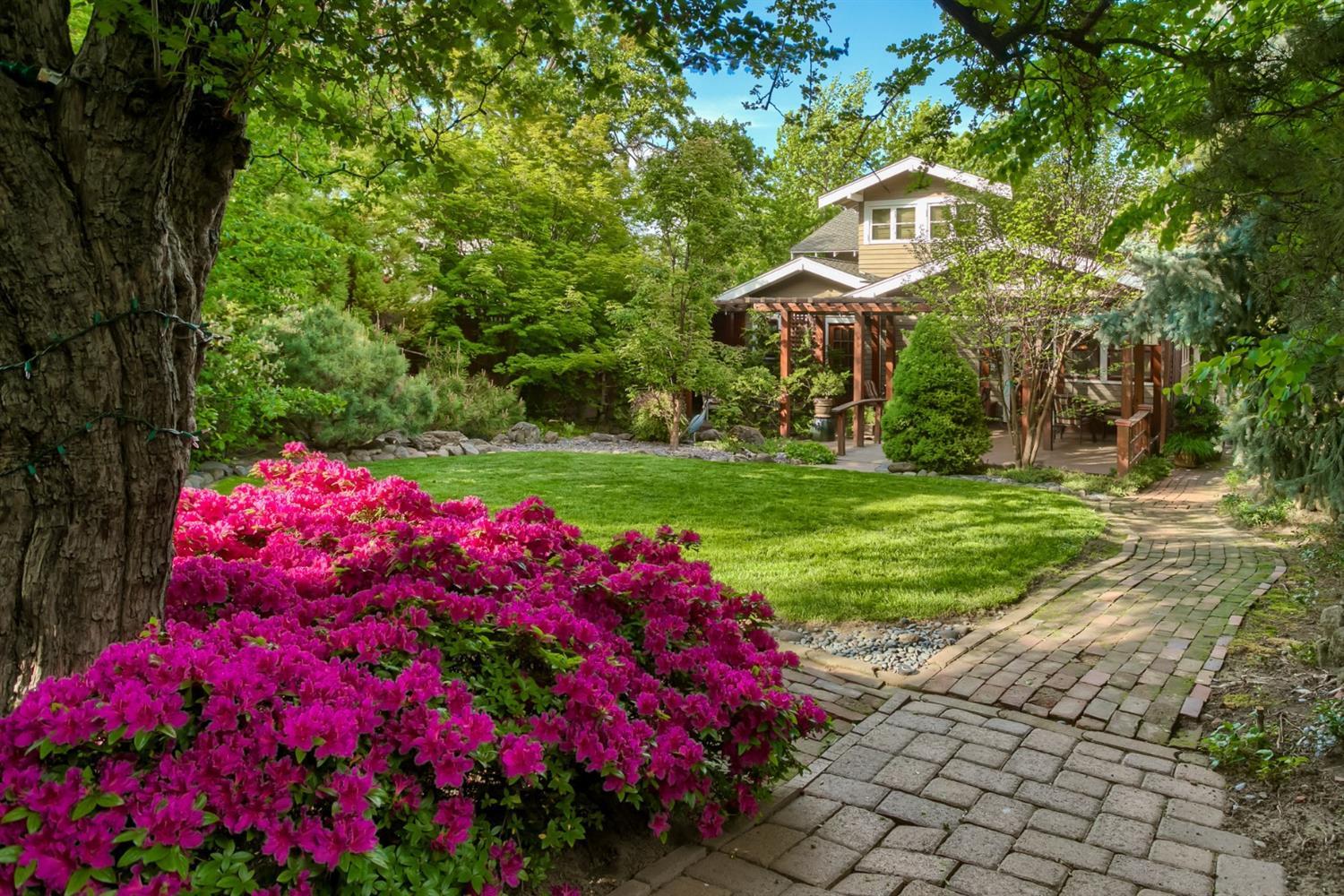 1913 Craftsman Bungalow with 4 vacation rentals in detached Carriage House just 1 block to Ashland's Plaza. This beautiful home has been impeccably cared for by the owners for over 30 years. Plenty of room for extended family or vacation rentals. 4 bedrooms & 3 baths in the main home plus separate Carriage House with 4 separate suites. Main home features charming living areas with original wood detailing, wood wrapped windows, fireplace & hardwood flooring. Craftsman dining room with inglenook & original built-in desk. Delightful kitchen with granite counters, gas stainless range, original cabinetry with glass doors opens to the sunny breakfast room. The main home & carriage house have well separated sleeping quarters, luxurious baths. Wonderful outdoor areas with ornamental pond, ferns, flowering plants, mature trees, lawn areas & covered patio. Perfect property for extended family or live in main home & have 4 or 5 income vacation rentals. Perfect AirBNB or VRBO property.
