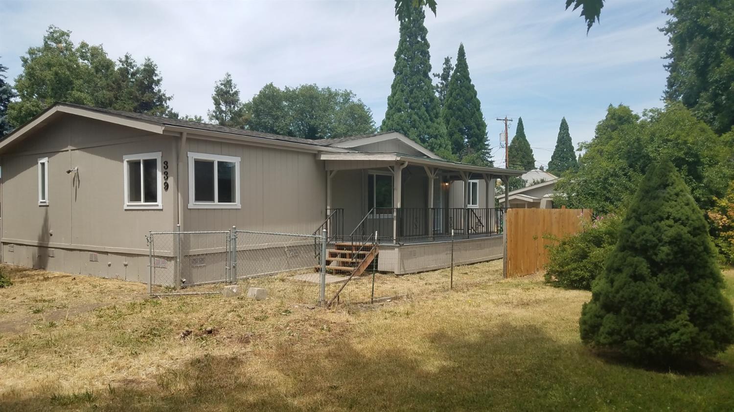 Come see this beautifully remodeled home! New roof, new vinyl double paned windows, all new flooring and fresh paint inside and out. The light , bright , brand new kitchen has plenty of storage space in the white shaker cabinets and the large corner pantry! There is a gleaming new suite of black stainless appliances. Both bathrooms have been updated and looks great! There is a nice sized detached garage and shop, a shed for additional storage and the backyard is fully fenced. The listing agent is related to the seller.