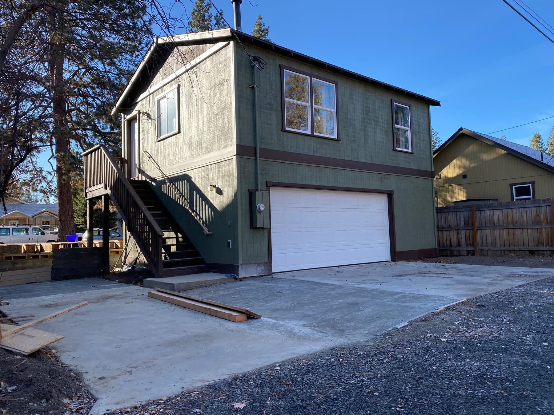 Brand New Construction on NW 14th and NW Davenport. Check out this amazing opportunity in the heart of NW Bend. A brand new construction farmhouse style house sits under a gorgeous ponderosa pine and features a permitted ADU above a detached 2 car garage. Access is from the the alley way, with ample paved parking. The ADU is move in ready! Located 3 blocks from Galveston Ave., restaurants, bars, parks, shops and grocery stores. Also, near the Deschutes River and hiking trails. One mile to Phil's Trail and on the way to Mt Bachelor. This is the opportunity you have been waiting for! Total square footage includes 600sqft detached ADU.