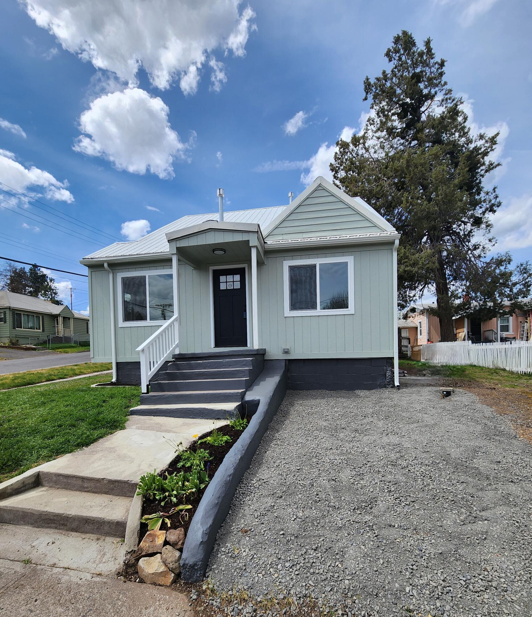 Price Adjustment-This house keeps getting better! Stunningly remodeled 2-bed/1-bath home. 1,084 square feet of stylish living space w/room for a 3rd bedroom. Every detail thoughtfully renovated, a bright layout allowing tons of natural light & an interior to showcase modern finishes & thorough upgrades in the home's essential systems including ALL NEW electrical wiring & panel, plumbing, heating unit, windows, siding, & a newer metal roof plus stainless steel dishwasher & stove. The finished basement adds exceptional value w/room for a spacious 3rd bedroom plus a versatile space perfect for laundry, creative workspace/studio & generous storage. The outside has been simply landscaped, making this property the definition of turn-key! Convenient off-street multi-car parking. Located close to downtown shopping, this home offers comfort, efficiency & timeless style. Home comes with a 1 year home warranty. Come see yourself in this beautiful home today! Listing agent & seller are related.