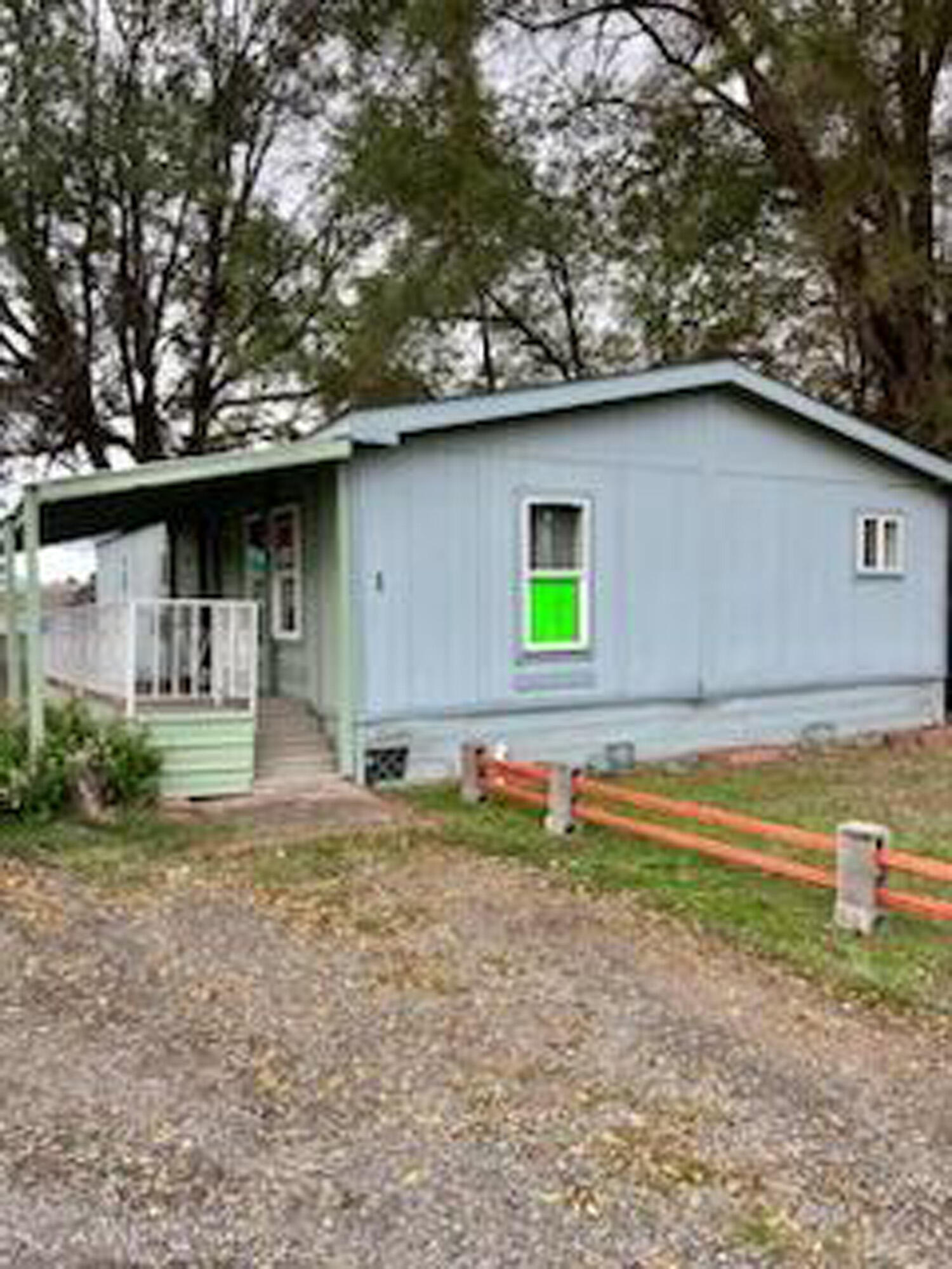 Clean and well-maintained manufactured home in Wiseman's mobile home family park is ready for it's new owner. This is the first home on the left as you enter the park so easy in and out. You enter into a large living room open to a dining area and kitchen. The hallway takes you to the laundry room, bathroom and three bedrooms to include a primary suite with an additional bathroom. There is also a nice sized backyard with storage.