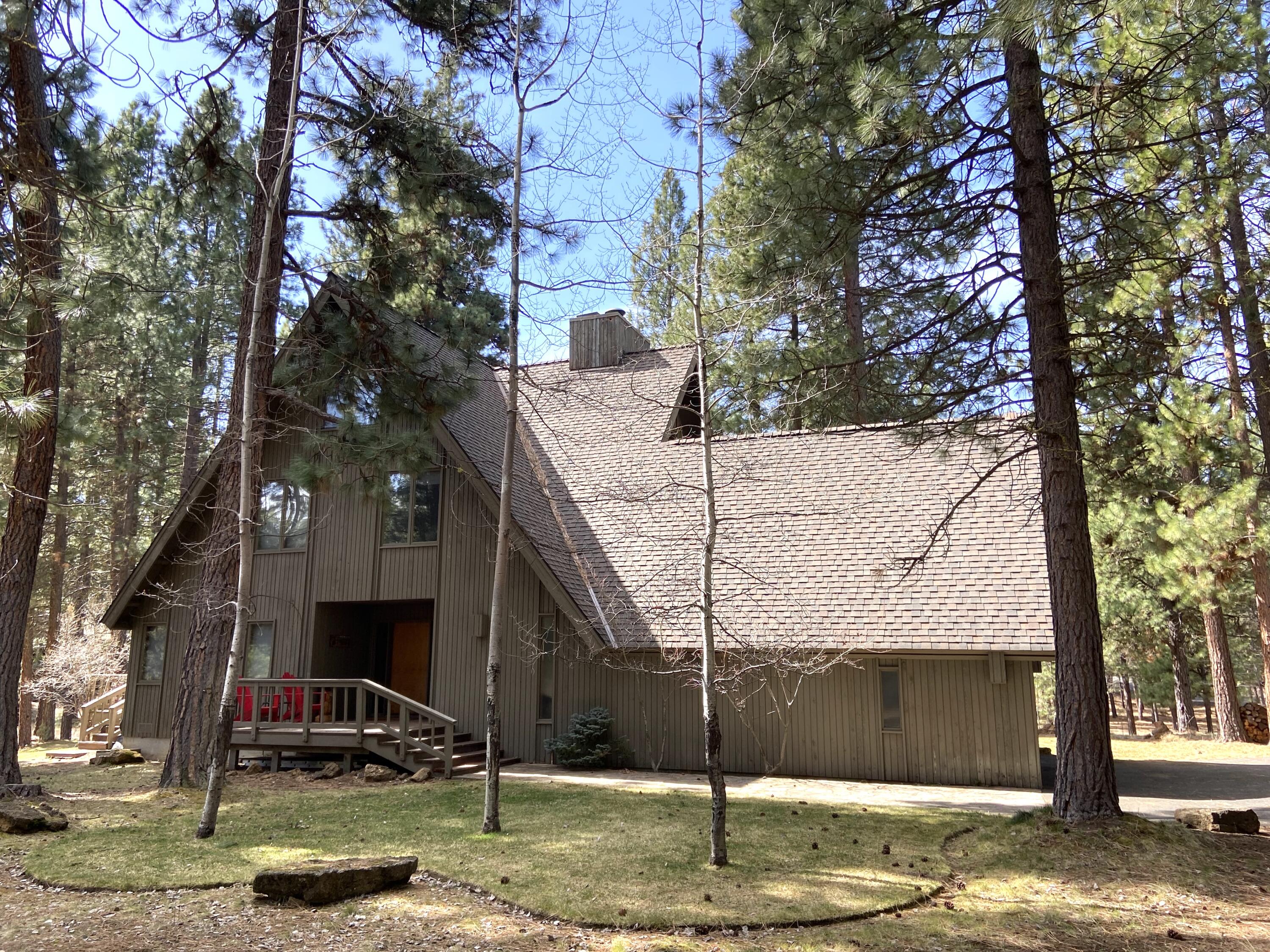 A great opportunity to own a large, recently updated home in a  desirable location at Black Butte Ranch. Featuring new hardwood floors, granite countertops and stainless appliances, two primary suites, a large bunk room and a huge bonus room. The remodeled kitchen opens to the dining area and living room. The living room has a vaulted ceiling and a floor to ceiling stone wood burning fireplace. Located on a large lot near BBR amenities, adjoining a common area and close to National Forest. Perfect for a big family or rental. Paved driveway offers plenty of parking along with the oversized, two car garage. There's a wonderful sunroom, decks and lawns for outside fun.