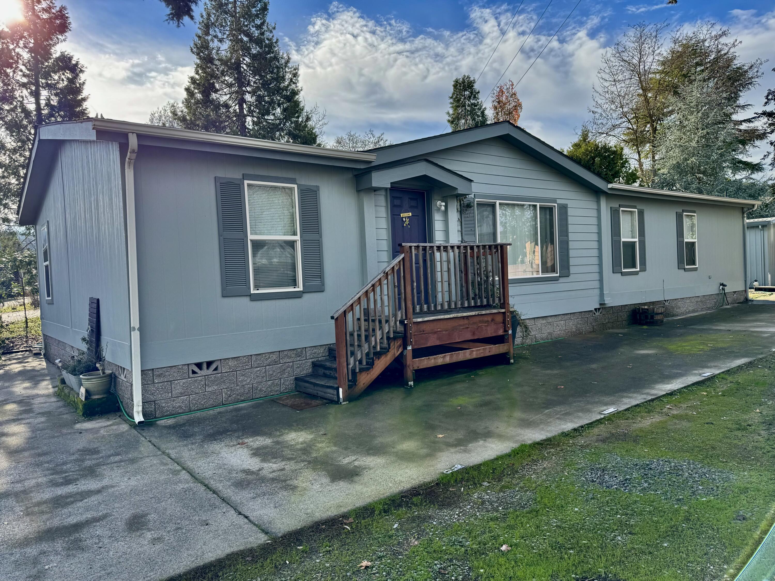 Beautiful meticulously maintained modular home with gorgeous kitchen/dining areas, great room, vaulted ceilings, enormous primary suite featuring separate office and big bathroom featuring garden tub and separate shower, two guest bedrooms; separate laundry room.   Lots of new flooring, an abundance of hardwood cabinets, vaulted ceilings, vinyl dual pane windows, full concrete block perimeter foundation, and vertical cement composition siding.
Included with the rented lot are huge concrete parking areas , plus steel RV cover,  plenty of room for garden and landscaping, and a nice detached shop/storage building with electricity and lights.  One of the nicest mfg home packages around!  55+