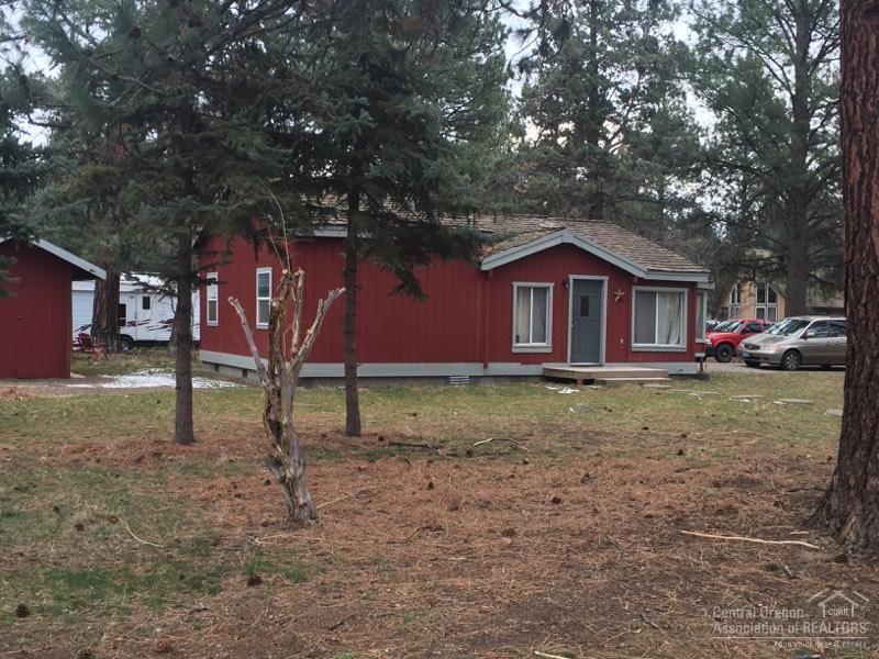 Two separate tax lots in the heart of Sisters, Oregon. Numerous possibilities from building to investment property. Currently home of a charming 3 bed 1 bath home. Surround by large Ponderosa pines and conveniently located near parks, shopping and restaurants. Currently occupied by tenant. Lease expires 5/31/2018. New windows, and pellet stove. Home being offered as-is. This is your opportunity to capture a piece of Sisters Oregon.