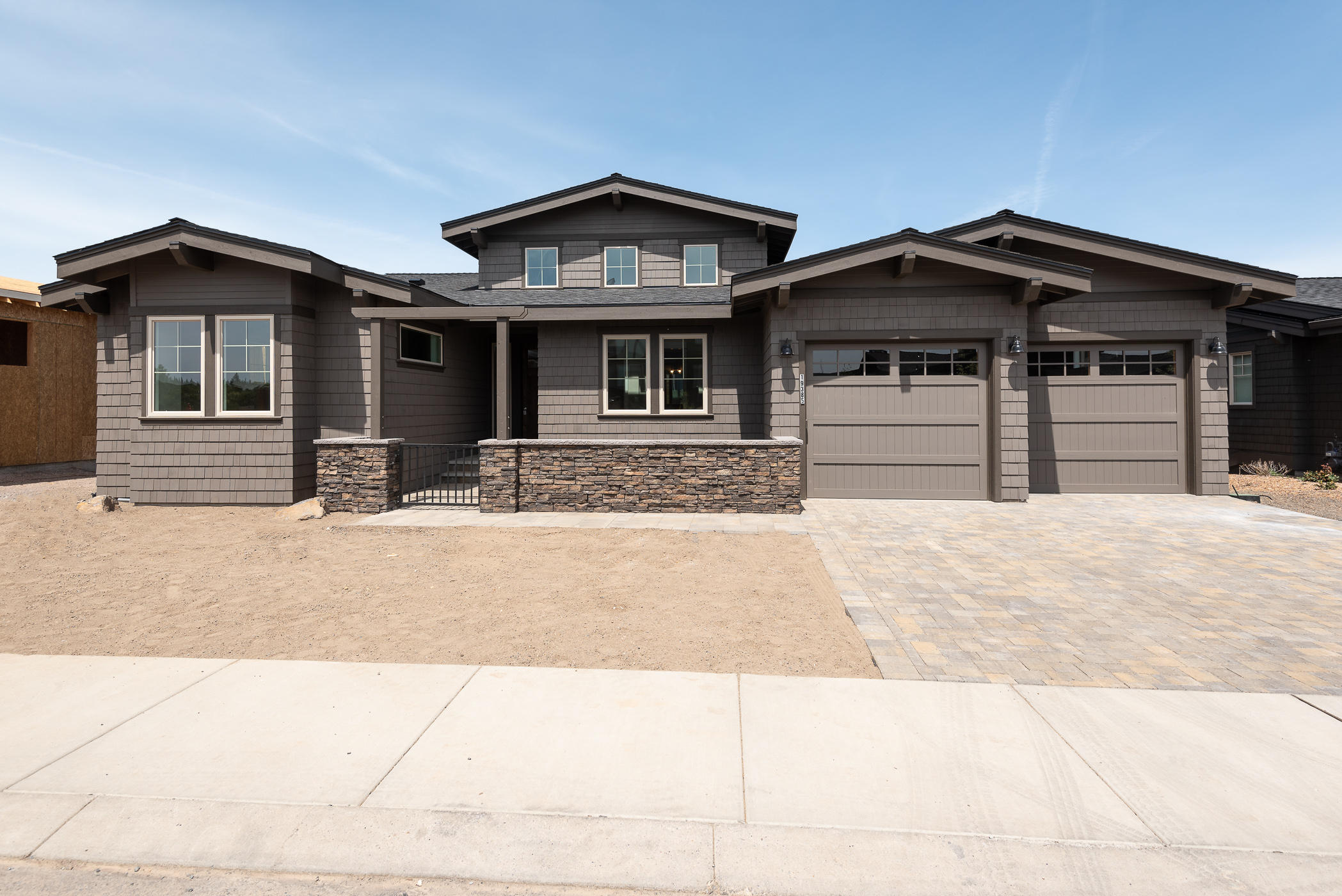 New home ready by the end of September. This stunning premium view lot with Cascade Mountain and golf course views is conveniently located on The Rim near the Tetherow clubhouse, fitness center, pool and 3 restaurants. Main floor master suite with fabulous bath & private balcony; gourmet kitchen opens to impressive great room with large balcony and incredible views. Conveniently located office on the main floor. 2 additional guest suites located on the lower level, daylight basement as well as a large bonus room. All landscaping is taken care of by the Rim HOA and affords you care free living! Enjoy all that Bend has to offer. Mt Bachelor, Cascade Lakes and Phil's Trial are all at your doorstep!