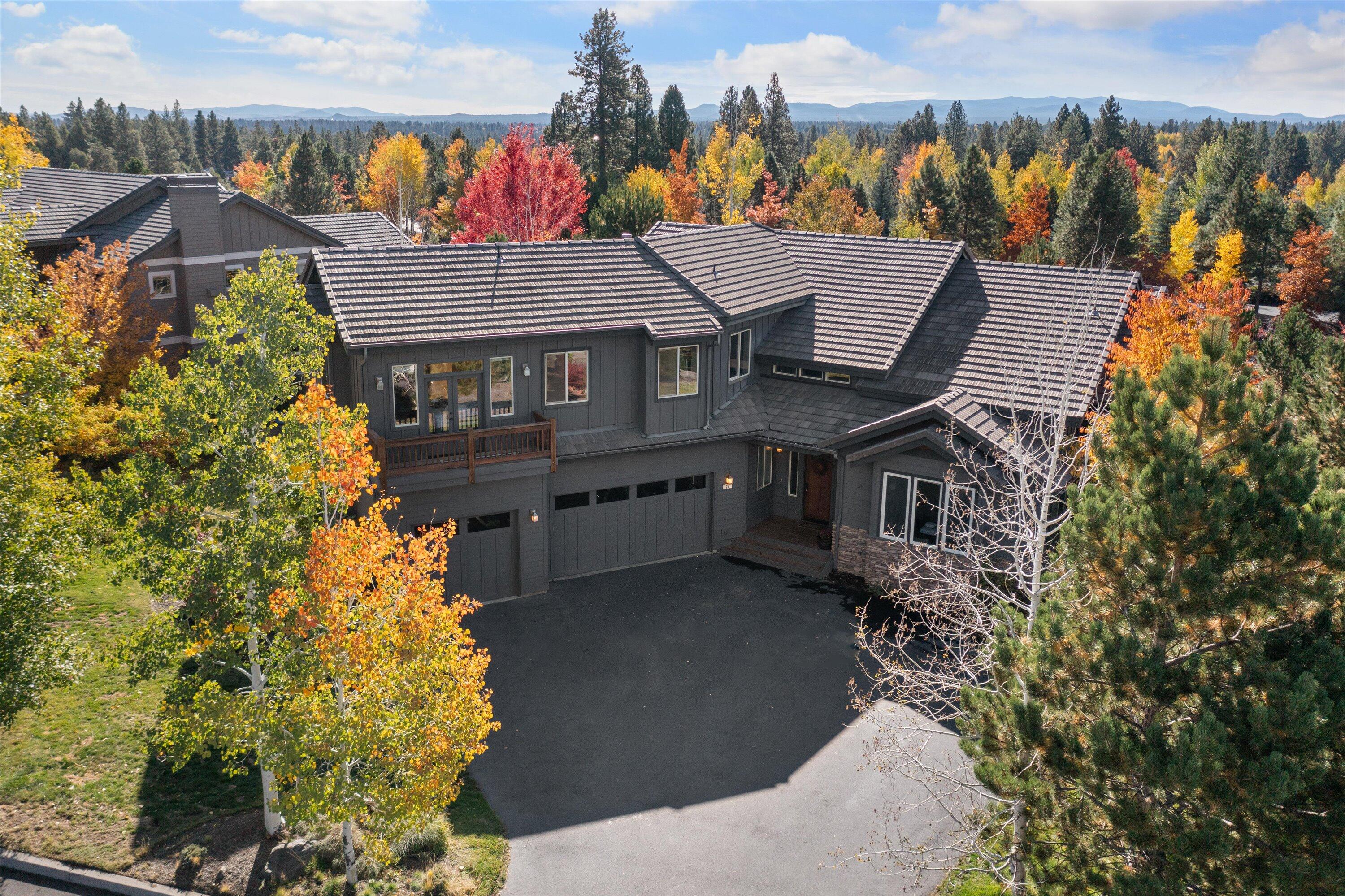 This thoughtfully designed 4-bedroom residence, with a dedicated office and a versatile bonus room is located on a large .37 acre lot in the heart of the westside.  Step inside and you immediately experience the grandeur and spaciousness of the soaring vaulted ceilings and the abundant natural light pouring through the expansive windows.  A floor to ceiling rock fireplace sets the ambiance for cozy gatherings. The updated kitchen features white cabinetry, stainless steel appliances, a convenient corner pantry, and a breakfast bar perfect for hosting friends and family.  The primary suite, with access to the back deck and backyard, and the home office are located on the main level.  Ascend the staircase to find three additional bedrooms and a versatile bonus room, offering ample space for relaxation and recreation. The 3-car garage will accommodate all your Central Oregon gear and a generous flat driveway provides ample parking space.