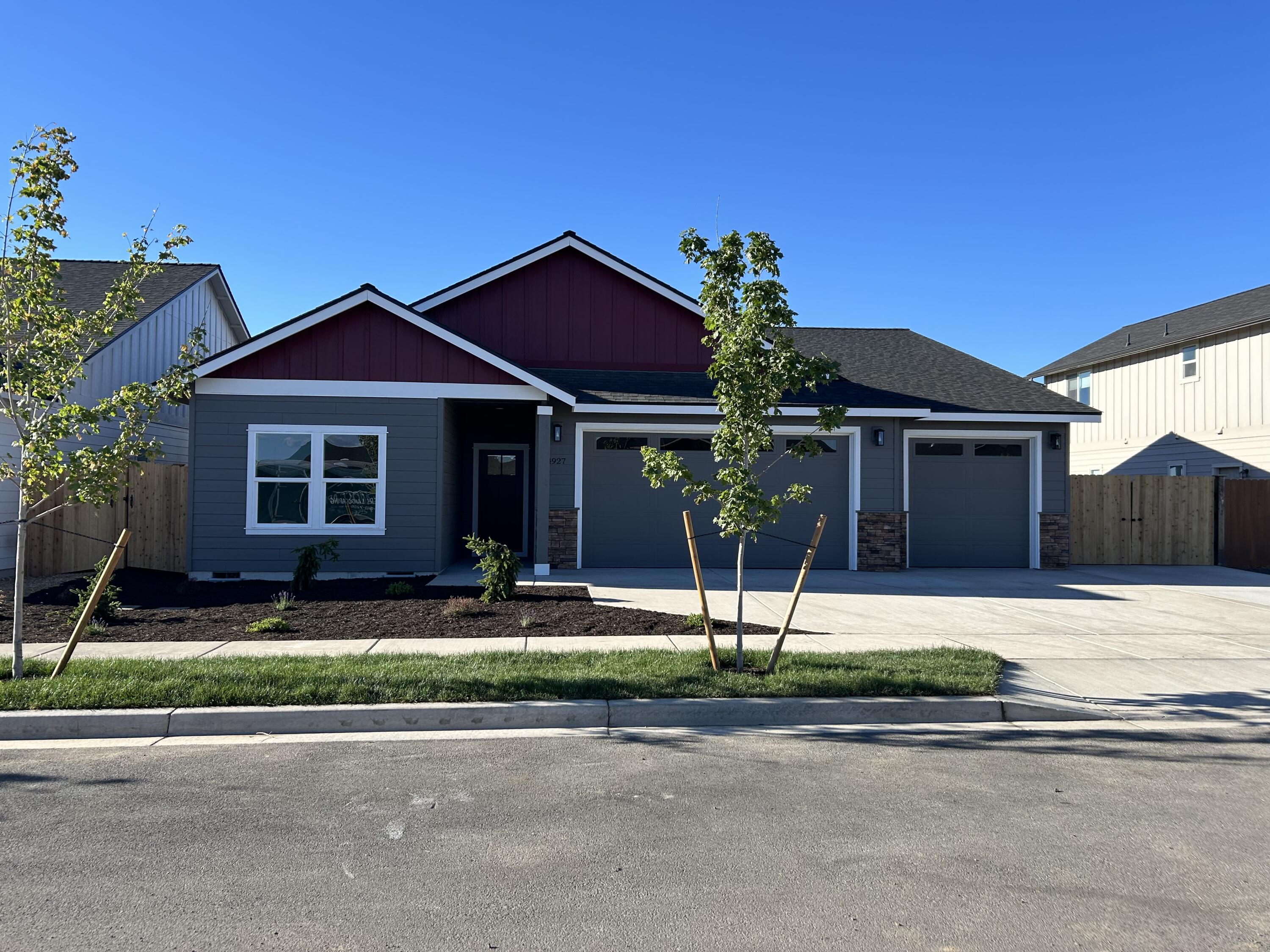 Welcome to Korbin Meadows, Phase 2, a new community in desirable neighborhood of SW Redmond. Lot 26 features the Summit floorplan w/ 2,284 sf of single-level living; 3 bdrms + den, 2 1/2 baths and 3 car garage. Vaulted primary bdrm features a lrg walk-in closet, dual vanity, shower w/ enclosed toilet. Great separation from two guest bedrooms sharing a full bathroom with tub/shower combo. Entertain in your kitchen w/ SS appliances, pantry, tiled backsplash, soft-close cabinets, extensive slab quartz countertops opening to vaulted dining area and great room w/ decorative gas burning fireplace. A utility/laundry room too! Durable laminate plank flooring thru-out & carpeted bdrms. Covered back patio, fenced yard & landscaping w/ sprinklers, RV/boat parking & entrance gate. Upgraded finishes & A/C included! Estimated completion July 2024.*Floorplan & rendering subject to change. Photos of home w/ similar floorplan. Interior finishes vary.