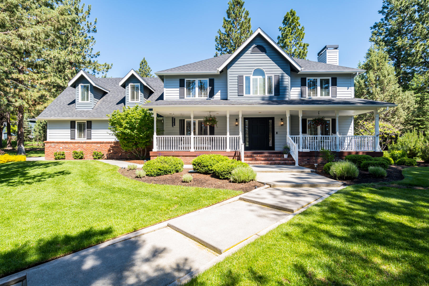 Experience the NW Bend lifestyle from this traditional farmhouse located on an EXQUISITE corner lot on Awbrey Butte.
Graciously situated on .69/acre in a true park-like setting, this 4BR/2.5BA gem of a home exudes warmth and charm,
beginning with the delightful covered front porch and unparalleled curb-appeal. Ideal floorplan features stunning
hardwood flrs throughout main level, classic plantation shutters, and a light-filled great rm w/gas fp and French doors
opening to back deck and patio. Cook's kitchen w/solid surface counters, SS Kitchen Aid appl, walk-in pantry and add'l
access to back deck for easy al fresco dining. Private main level home office. Upstairs: Primary Suite w/cozy gas fireplace
and spa-like bath with quartz counter vanities, soaking tub and tiled shower. 3 add'l spacious BR, full BA and fantastic
bonus room upstairs. Lush landscaping and multiple outdoor spaces to enjoy relaxing or entertaining year-round.
Excellent proximity to all Westside schools and amenities.