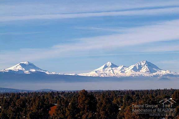 Awesome Panoramic Cascade Views from Bachelor to Hood and more on this almost 5 Acre Private Lot bordering Public Lands and with paved road frontage. Buyer will have multiple choices of flat building sites with mountain views and the Seller will pay for Septic Test & Approval at the Buyers chosen spot. Electric is on the property. View property this close to Bend in this price range is rare these days. Not just a drive by as the upper property has Awesome Views. Owner Financing Available Too!