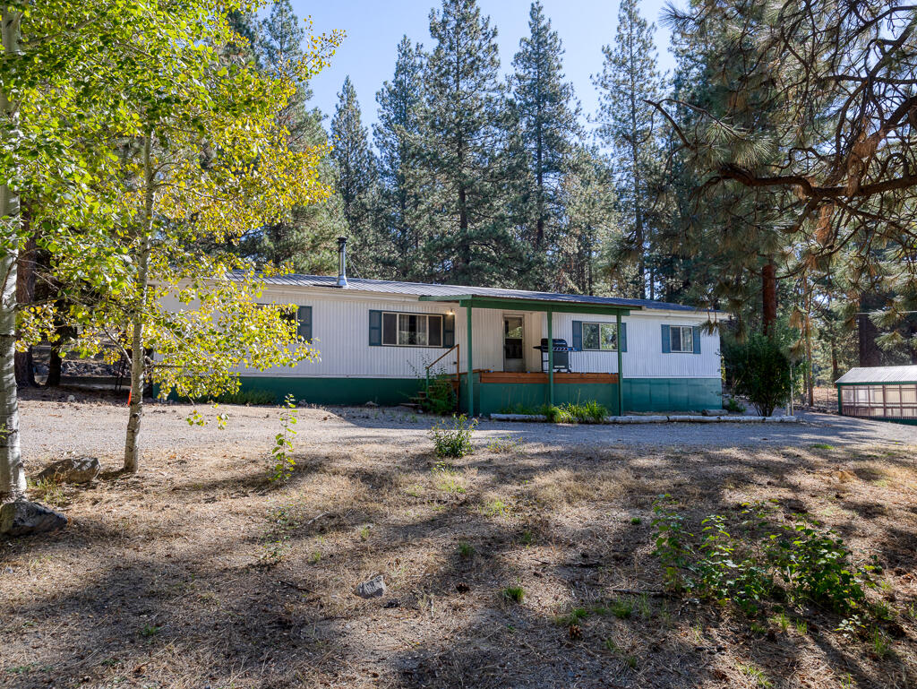 Welcome to 40225 Lobart Way—your private retreat on 1.68 acres with a park-like setting and mature trees for seclusion. This 3-bed, 2-bath home offers a perfect blend of comfort and function with a new automatic gated entry, privacy fencing, and a spacious double horseshoe driveway. Inside you'll find new carpet, a cozy oil furnace, and an oversized wood stove that keeps the whole home toasty. Thoughtful updates include a new septic system, large laundry/mud room, and a bright sunroom wired with electricity. Enjoy multiple outbuildings including a greenhouse, storage sheds, and chicken coop, plus RV parking with full hookups. The detached garage and new deck add even more value. With two gated entrances and just moments from Spinks Park, this location is ideal for outdoor recreation while offering peace, privacy, and convenience.