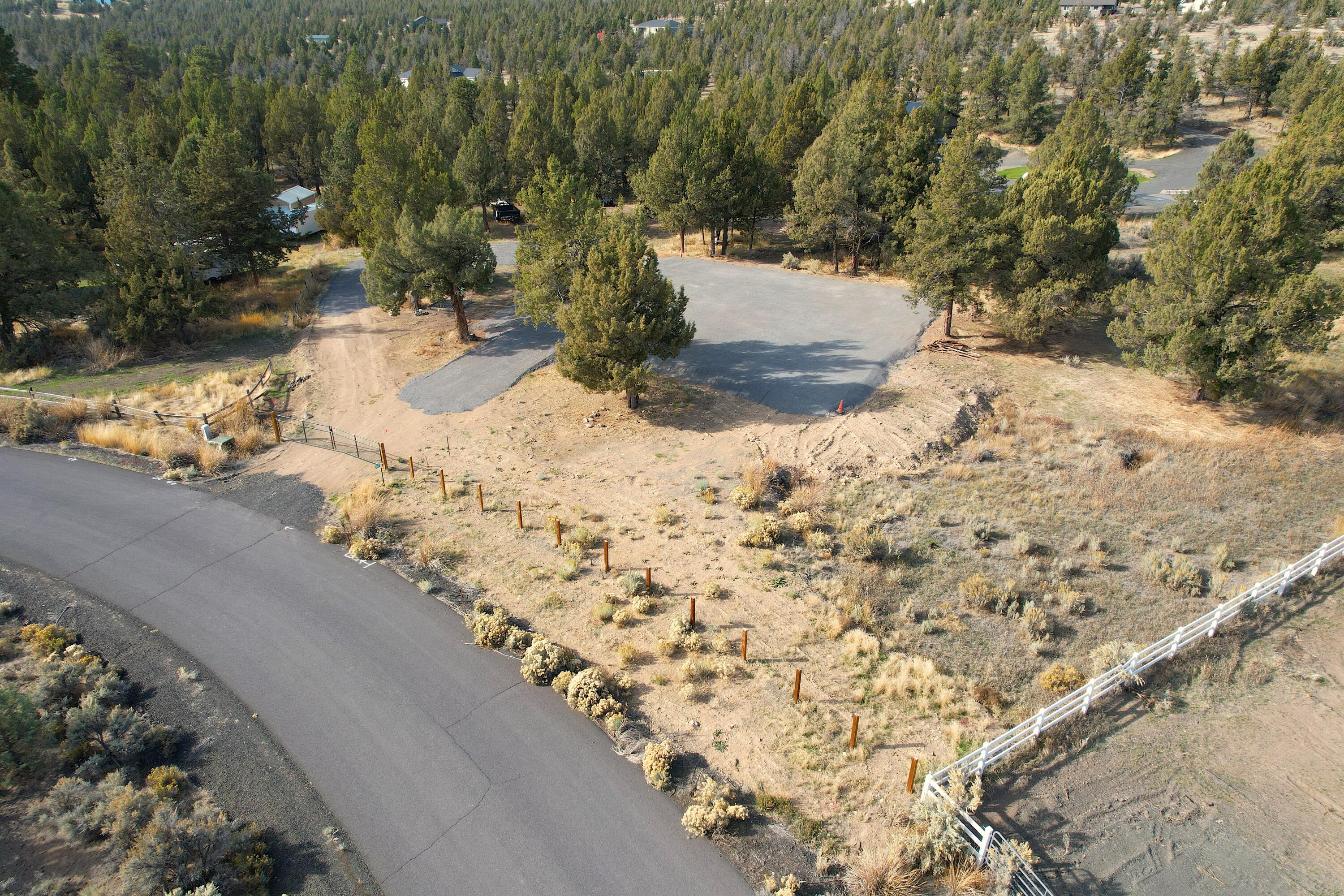 3.5 Acres in Cimarron Hills ready for your new home or Barndominium! The property has power at the lot line, septic approval for a standard septic system, a large compacted raised gravel area for building, a private well, and a set of engineered plans for a  60'x60' barndominium with second story storage! There is a seasonal creek that runs through the property and two legal access points. Call today for a showing!