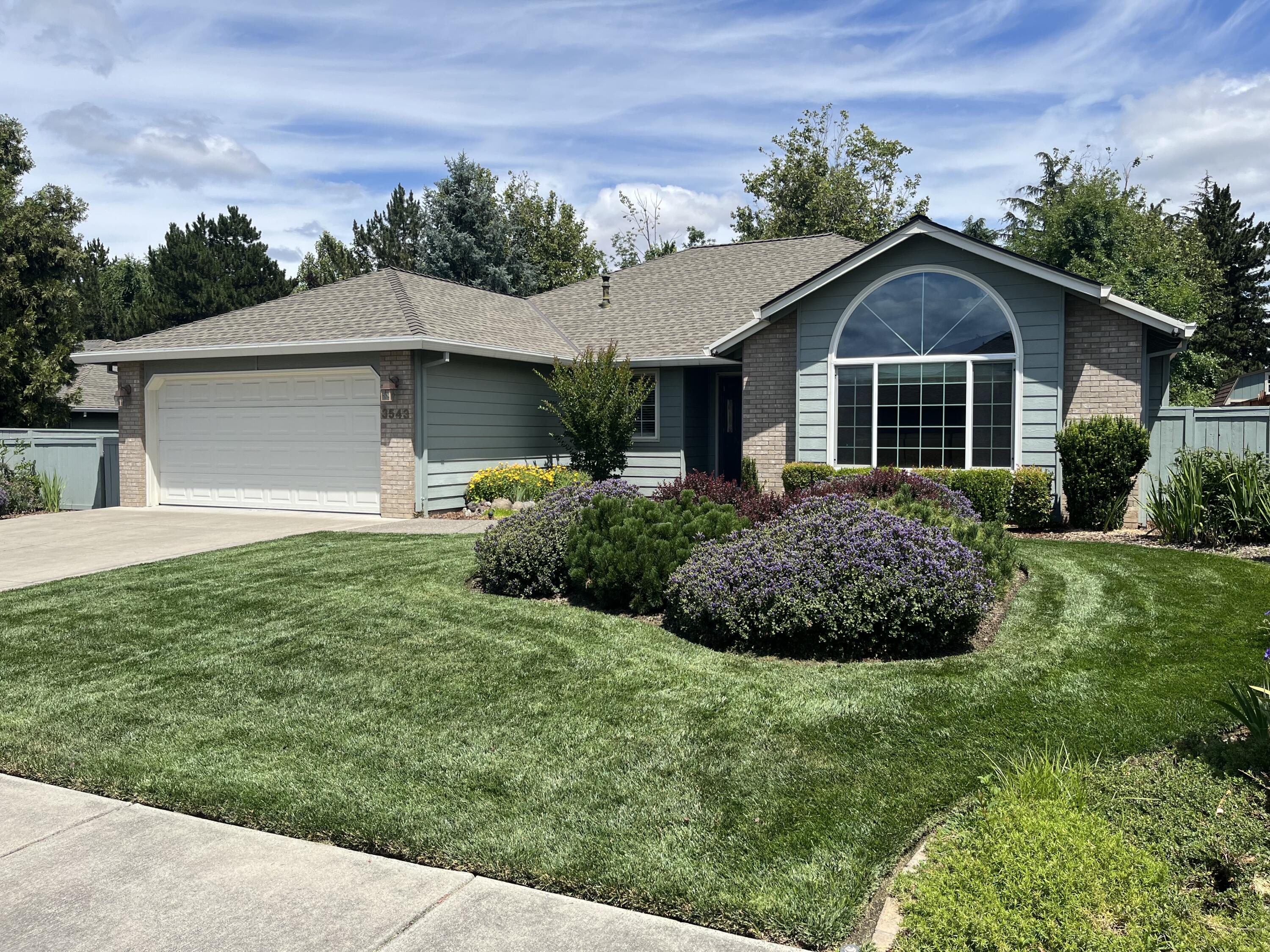 Explore the charm of Larson Creek neighborhood with this meticulous home that backs up to Larson Creek for added privacy. Enter the front living room that takes in natural lighting and overlooks the beautifully landscaped front yard. The spacious kitchen features an island bar, sleek refinished cabinets, stainless steel appliances, and granite counters. Enjoy breakfast in the cozy nook and the views of the pergola covered back patio. The family room seamlessly connects to the expansive backyard. Retreat to the generous master suite with another slider leading to the backyard oasis. Conveniently located near shopping, dining, and Asante medical facilities, and bordered by scenic trails along Larson Creek.