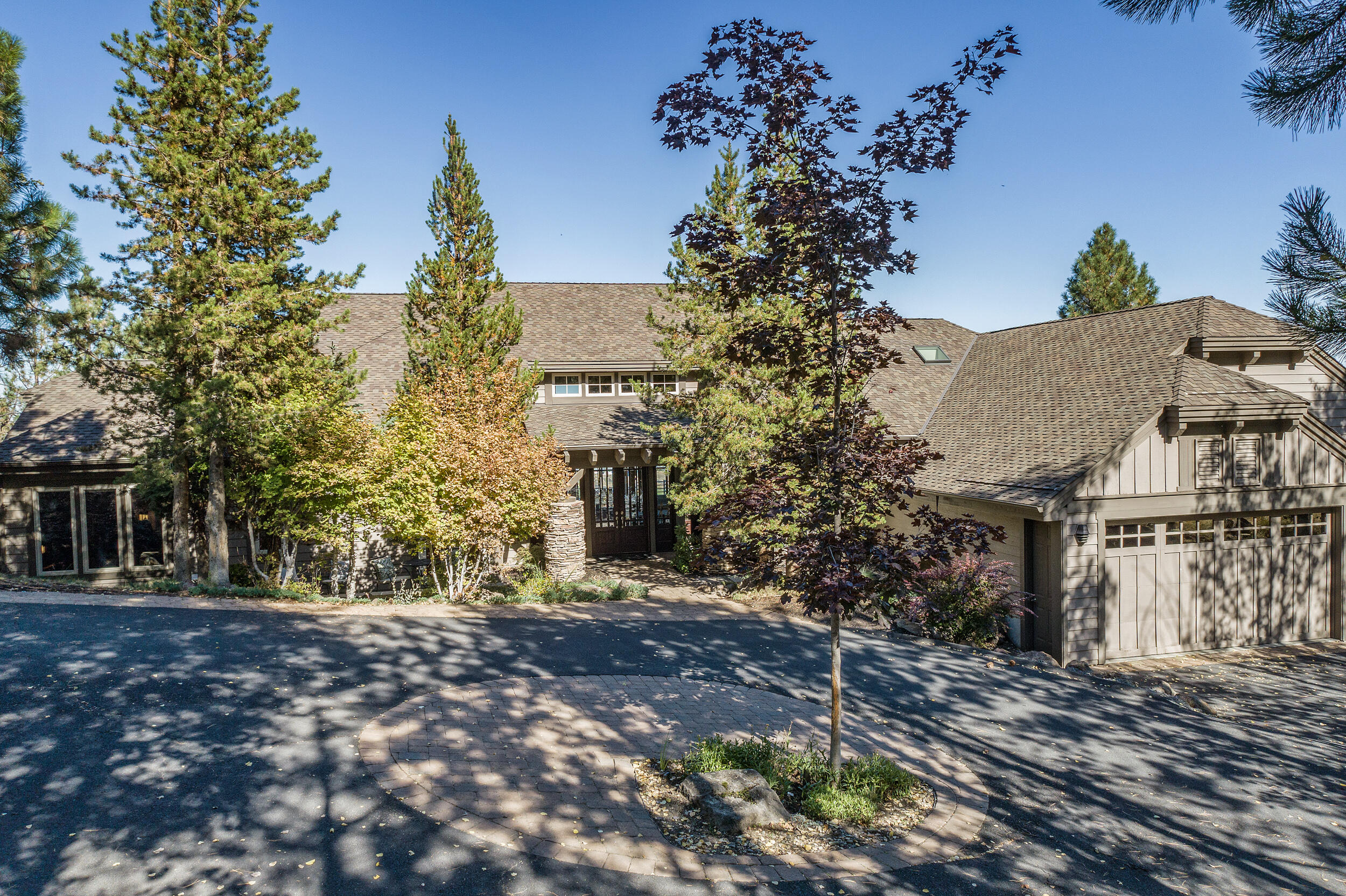 Enchanting single level home artfully blends Northwest and contemporary design to perfection. Set on exceptionally private .61 acres w/in Bend's popular Westside neighborhood of Hillside Park, the floor-to-ceiling windows of this lovely home capture breathtaking panoramic views. The well laid out floorplan provides living spaces for all occasions; from the welcoming great room w/ fireplace, wet bar, iron gated wine closet, to the casual dining area & well equipped kitchen, all enjoying fabulous views & opportunities for alfresco gatherings on the expansive decks; as well as formal dining room & office/den, each w/ views of tranquil stream & waterfall off the front patio.  Peaceful primary suite is warmed by cozy fireplace, an elegant bath w/ soaking tub & private terrace access from which to enjoy the rising sun & evening stars. Two guest rooms provide inviting accommodations for family & guests. Potential to add approx 1,200 sq. ft. of living area in unfinished lower-level, plans inc.