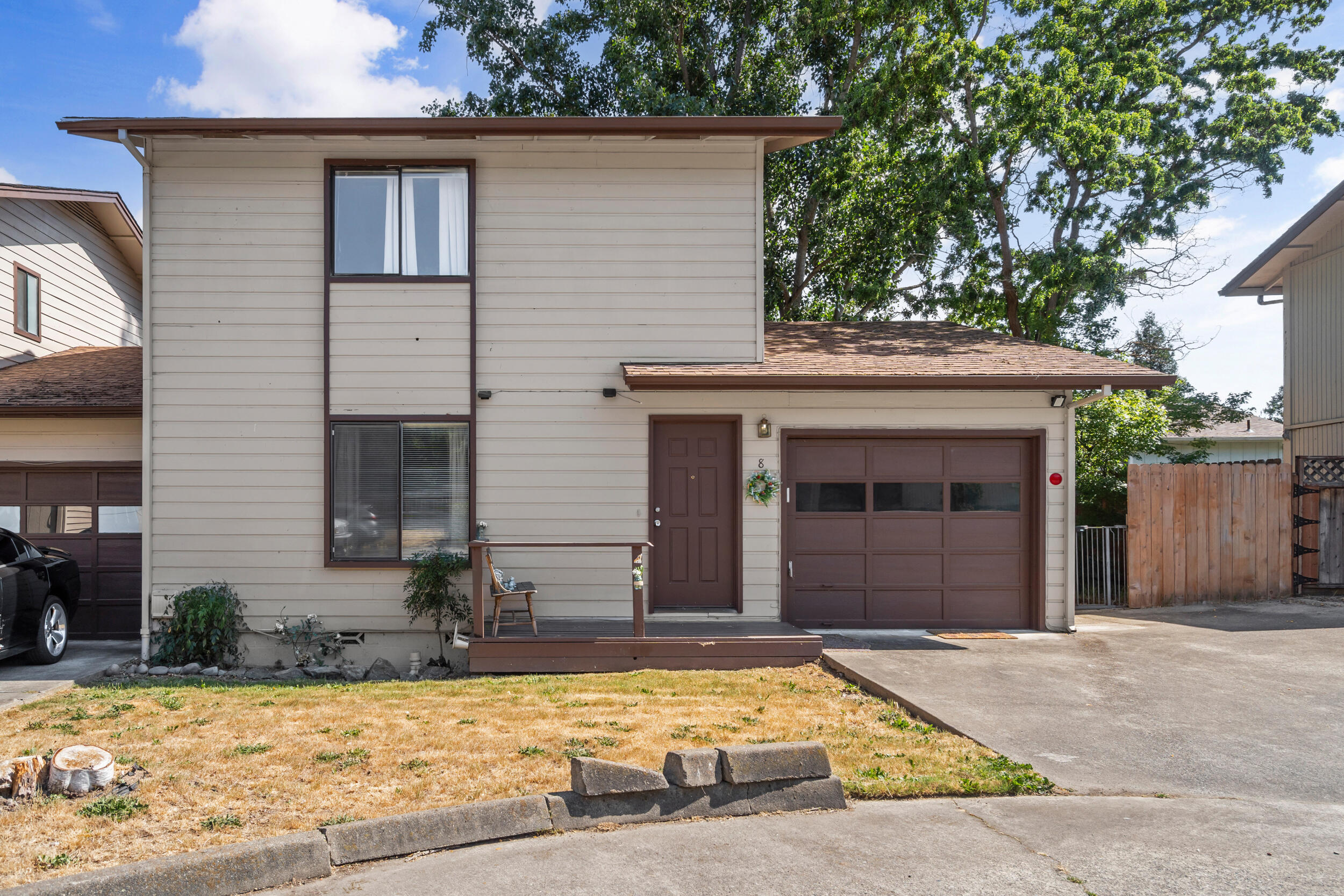 Welcome home to this bright and spacious two-story townhome in the peaceful Royal Oaks Estates community. Featuring 2 bedrooms, 2 bathrooms, and 1,188 sq ft of functional living space, this home offers a comfortable layout with both bedrooms upstairs and a full bath on each level. The efficient HVAC system provides year-round comfort, while the attached one-car garage offers extra storage or workspace. Enjoy outdoor living with a fully fenced yard, a large patio off the kitchen—perfect for morning coffee or BBQs—and a side yard ideal for pets or gardening. HOA fees include landscaping, trash, water, and sewer for easy living. Conveniently located near downtown Grants Pass, shopping, hospitals, and within District 7 schools. Don't miss this opportunity!