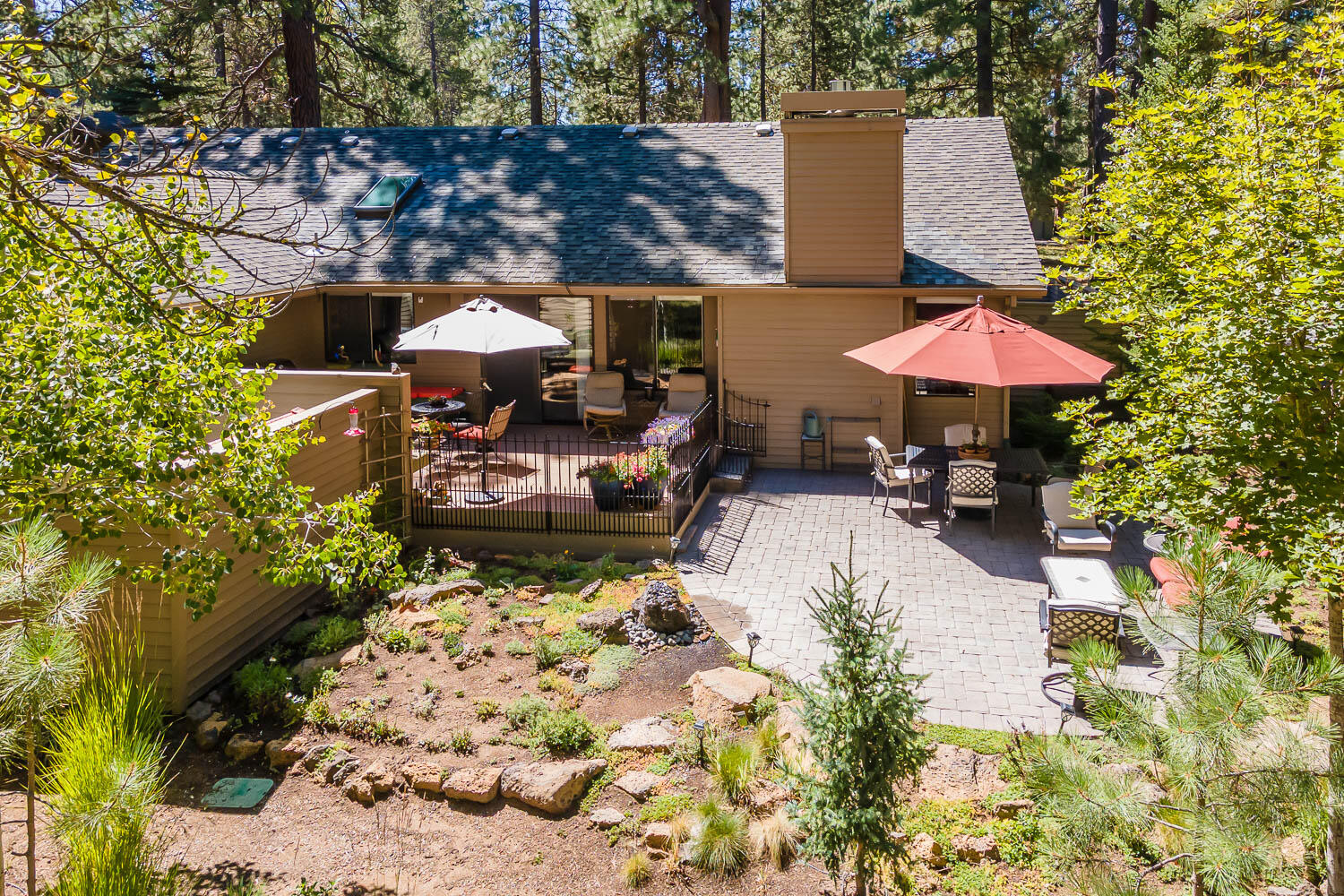 Your Sunriver oasis awaits - this impeccably cared for, single level home has 3 bedrooms PLUS a den, and is tucked away on a quiet and beautifully landscaped lot. Thoughtful updates including granite countertops, stainless appliances, and hardwood flooring, pair seamlessly with timeless features such as an open floor plan, vaulted tongue-and-groove cedar ceilings, and a gas fireplace. The spacious primary suite is situated at the end of hall, past the 2 comfortable guest rooms, boasting deck access and an en-suite bathroom with dual vanity. Enjoy the vaulted family room/den with it's own, private deck space & attached office nook - perfect for movie night - or step outdoors to lounge on the deck & paver patio, and star-gaze from the private hot tub. Find extra storage in the attic space above the attached 2 car garage. However you choose to ''Sunriver,'' this home offers something for everyone!