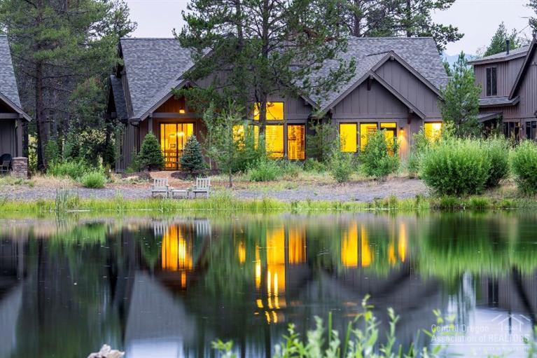 Caldera Springs Cabin 15 offers vacation home living on scenic Obsidian Lake. Near Caldera Links golf, the Lake House, Quarry Pool, sports courts, and social activities. Designed for rental appeal, this plan has 4 master suites (upstairs has built-in bunks, living area & full bath), a den, 5 full baths, double garage, energy efficiency and quality finishes such as wide plank hickory floors, knotty alder cabinets and doors, stainless appliances, slab granite, paver stone covered patio, & many upgrade featur