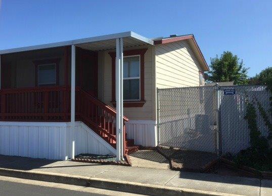 An amazing value for the first-time homebuyer, young family or retirees! This double-wide manufactured home boasts 1782 sf of living space and was built 2004. Three bedrooms and two full bathrooms with large family and living room. 60-foot-long screened-in deck perfect for relaxing with a cup of coffee. One covered parking space. Home is on large corner lot in Meadow View Estates all-family park. Space rent is $540/month