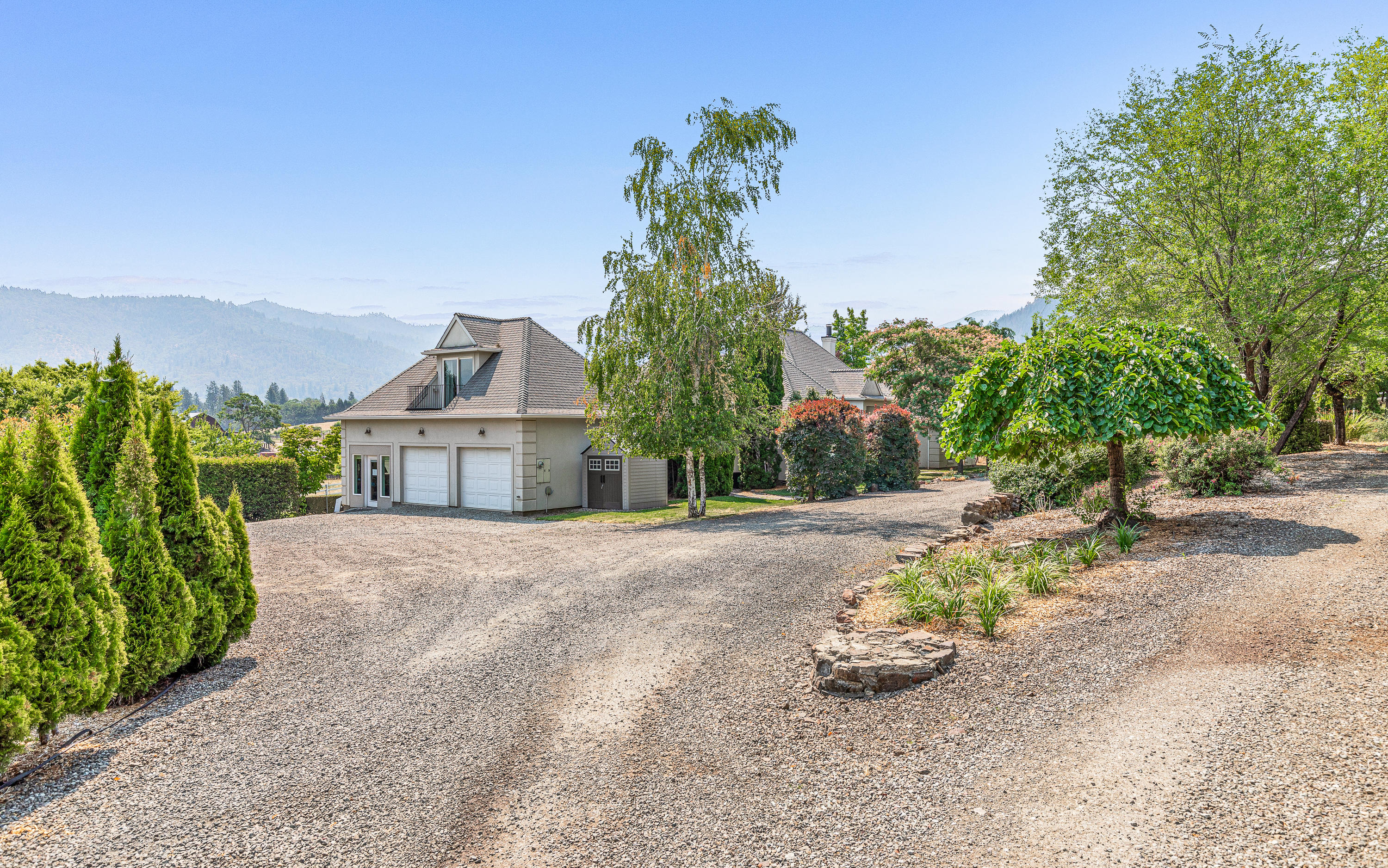 Looking for the Oregon Dream in Beautiful Southern Oregon? Here it is!! Home of the Vineyard for Ledger David Cellars in Rogue Valley. This Estate Vineyard sits on 26 acres with 24 of those acres irrigated & 15 acres of them planted with approx 1800 plants per acre of 11 grape varietals. Existing active permit for winery & tasting rm that is grandfathered in. Vines produce approx 60-70 tons of grapes per year. Vines planted in 2007; first wine produced in 2009. Gated entry, German Built Barn/Tasting Rm w/extra storage, upstairs office rm, studio & bath. Provincial style home w/high ceilings, lots of large windows, open kitchen w/granite counters; 4 Bdrms/2.5 Baths; TID Irrigation. 2 windmills and Irrigation equipment stay with property; Circular drive w/guest parking for 20+ cars. Well approx 9 GPM w/2000 Gal holding tank.