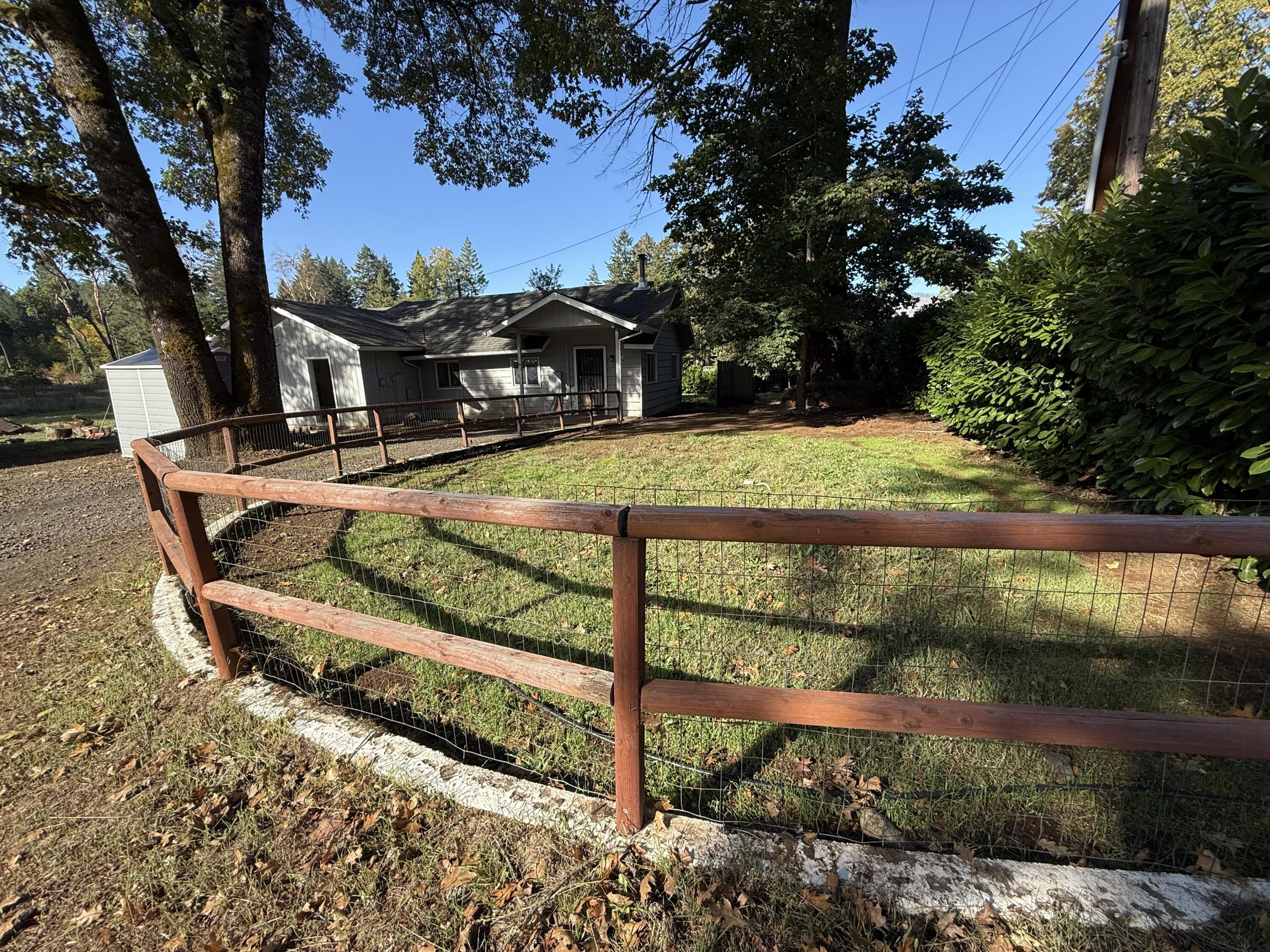 Oldie, but Goodie. Simply,  a charming older home,  that is located very close to city conveniences.  Living room, dining area and kitchen are in the main portion of the home, with MB & 2nd Bd & Laundry just steps down the hallway. . Bright , step saving kitchen and laundry close by. The home is serviced by a fairly new septic system (2019) and a well. The detached shop, is used mostly for storage  ;it does have a bathroom too.
Property is all level, partial fencing. Plenty of room for a garden. Some Fence post in, needs fencing.   Check this one out....