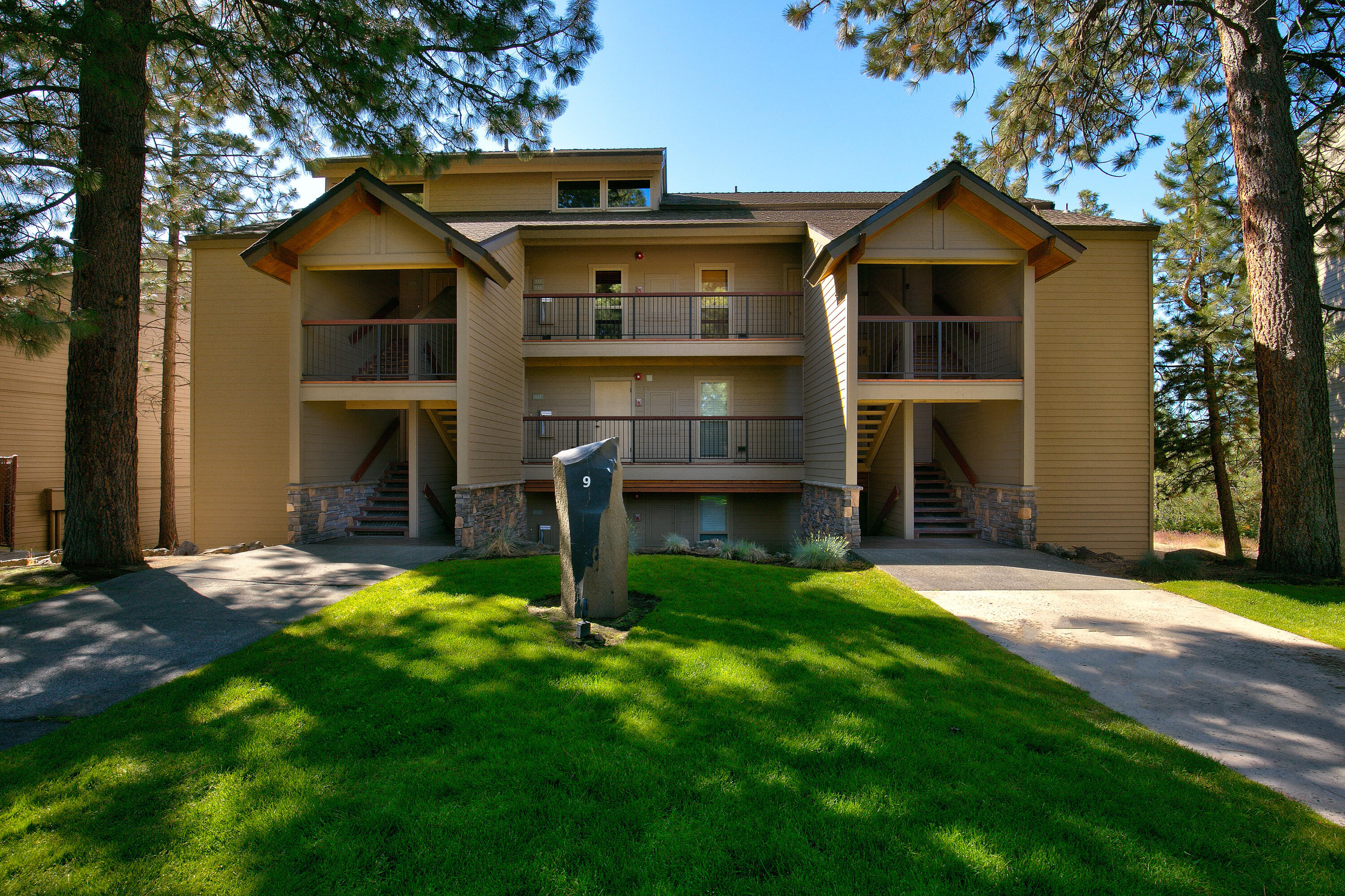 Wow! This turn key & rental ready Seventh Mountain vacation condo is centrally located in building #9 on the second floor from which you'll have easy access to Bend, Mt Bachelor, the Cascade Lakes. Enjoy an array of recreational opportunities on-site such as 2 year-round heated pools, multiple hot tubs, a gym, sauna, sports courts & playground. There is seasonal mini golf, disc golf, ice skating and even a wonderful restaurant - all within easy reach. EV chargers on site. Cook dinner after a fun day outdoors in the spacious kitchen, relax by the cozy wood burning fireplace after a full day of skiing or sit out on the deck in the sun simply taking in the beautiful forest views. Buildings were re-numbered DIAL states #437 but it is now #921. With a great rental history this one is a no-brainer!