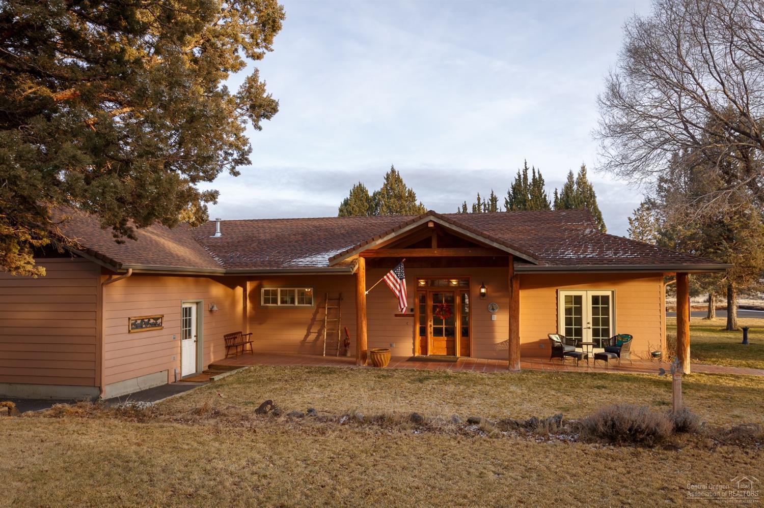 Looking for Peace & Quiet? Welcome to your own private retreat on 20 acres in beautiful rural Redmond, Oregon. This is a truly unique opportunity to own a custom-built single story U-shaped home surrounded by a quiet pastoral landscape. Property includes a circular paved drive, scenic pond and 2000+ sq ft Shop. Relax on your large covered front porch or courtyard patio. Watch the wildlife and star-gaze from the brand new hot tub. Enjoy distinctive vaulted T&G ceilings and hardwood floor in great room. Kitchen and baths feature gorgeous Saltillo-look tiles. Two propane fireplaces (1 inside/1 outside). Granite kitchen counters. 3 Bed/2Ba. Master and Guest bedrooms feature private access to exclusive patios, 2 car attached garage, RV parking/hookup. Home has several universal design features including 36'' doorways. Do not miss this chance to own a piece of Central Oregon!