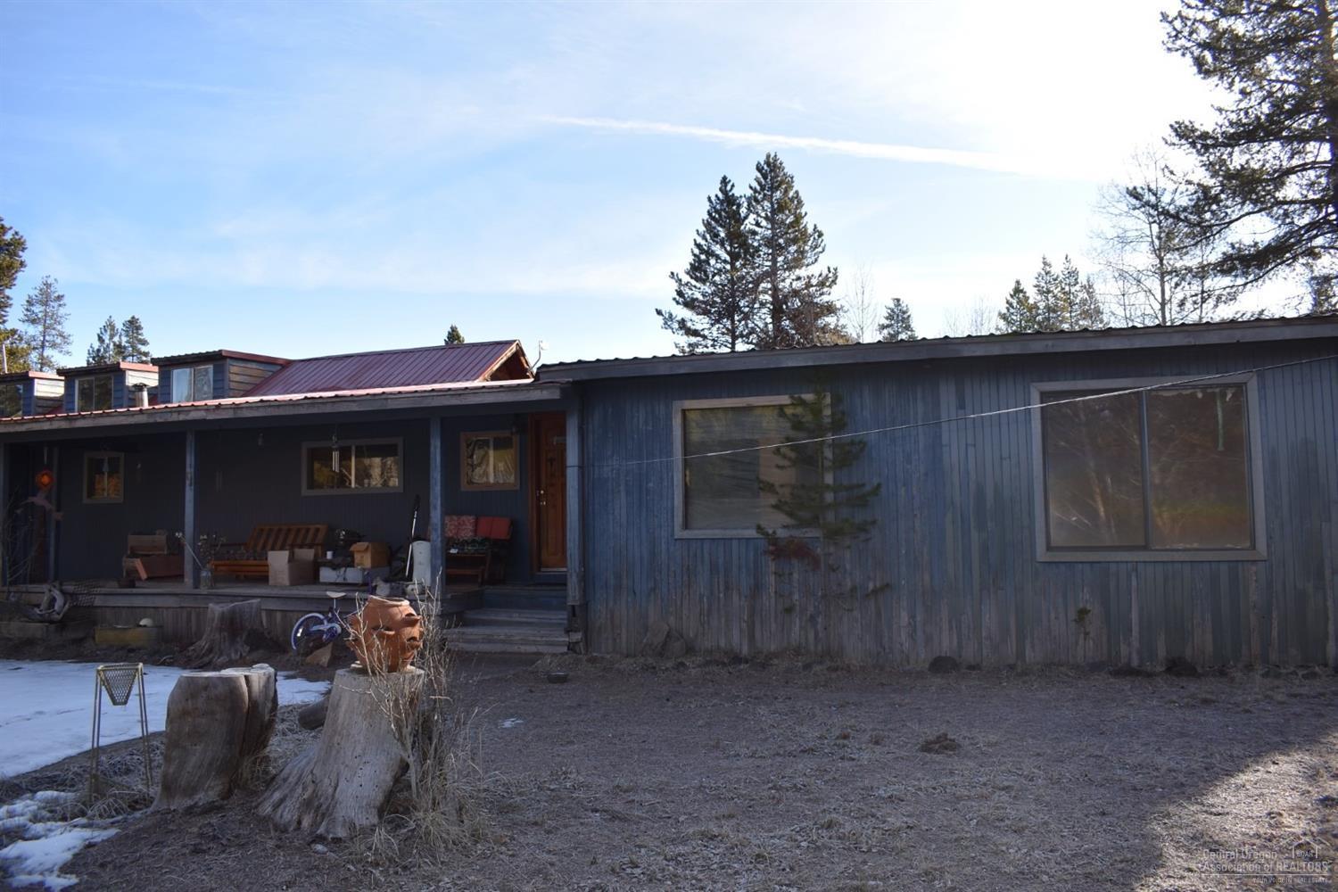 Investor alert! Who wants a nice 5 acre parcel with sweat equity opportunity. This one needs tons of TLC or a bulldozer. Priced for quick sale so call your favorite realtor today to check it out. The land features nice mature trees and some small outbuildings.