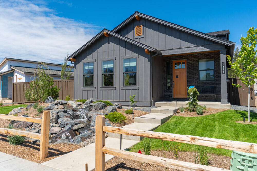 This is the MODEL HOME, Everett plan built in Treeline (Lot 21). This beautiful home, has the primary bedroom on main level. The gourmet kitchen is a chef's dream come true. It features stainless steel appliances (including W/D and fridge), custom cabinetry, a generous center island with a breakfast bar, and exquisite quartz countertops. Whether you're preparing a simple breakfast or hosting a culinary masterpiece, this kitchen will inspire your inner chef. Upstairs greats you with a spacious loft, separate office area and secondary bedrooms . This home is on a sizable lot and has MANY upgrades (some not even offered to other builds) including water feature and outdoor fireplace. Nestled in northwest Bend, this property offers the best of both worlds - a serene retreat in nature while being conveniently located near the Northwest Crossing amenities. Enjoy the nearby hiking and biking trails, golf courses, and recreational activities that make Bend a sought-after destination.