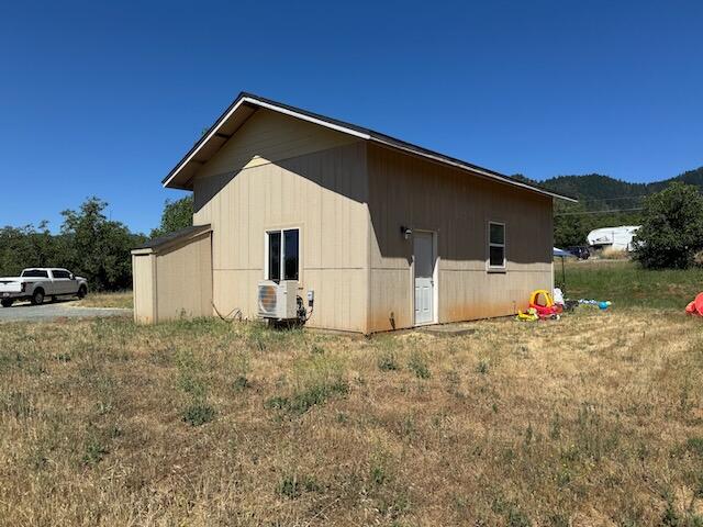 2.75 acres with 2018 built 1 bed / 1 bath. Seller built to live in with the idea of using as a guest house after the larger home was constructed. Next house was never started, so what will you do? Water, septic and power are ready to go. On the corner of Cloverlawn and Summit Loop. Ready for access from both streets. Complete with your own mini-grove of walnut trees. Nice opportunity for newer construction to live in while you work on your master plan.