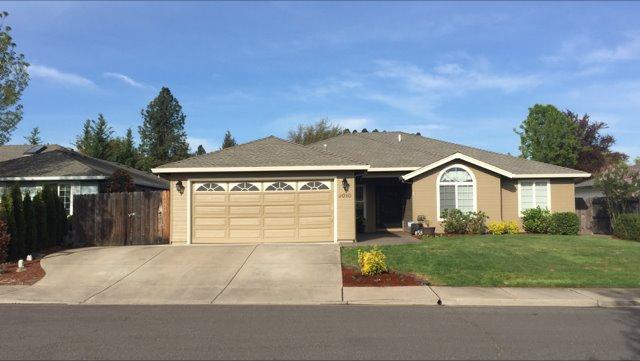 Looking for that immaculate SW Medford 4 bedroom home? Look no further! This home has an amazing open concept floor plan perfect for entertaining. The kitchen includes gorgeous stainless steel appliances, a large island w/ eating bar, gas/range/oven, and large dining area. The great room includes a floor to ceiling corner stone gas fireplace w/ raised hearth & mantel. Hardwood floors are in the entry, dining kitchen, hallway. Bedrooms & great room are carpeted for warmth. Master Suite includes large walk-in closet & slider to pool & patio. The backyard features a quality gunite in-ground swimming pool, large covered patio w/ an amazing outdoor wetbar with lighted cabinetry & plumbed for a mini-fridge. The pool includes a new pump house & new lights. Home has newer exterior & interior paint; and did I forget RV Parking. Must See!