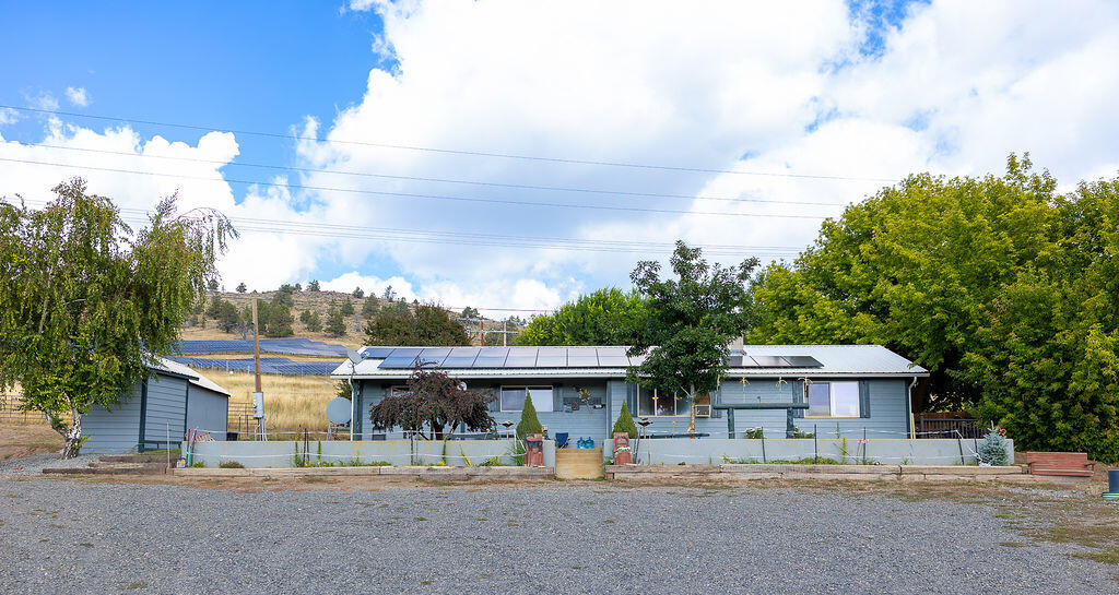 Charming 3-bedroom home on 7 acres-Horse property close to town. Don't miss the opportunity to own this beautiful-3 bedroom, 2 bath home nestled on 7 acres usable acres! Perfectly set up for horses lovers, the property includes 5 fenced pastures, horse stalls, hay storage, horse arena and plenty of room to roam. Inside, you'll find a spacious open floor plan with a desirable split-bedroom layout, ideal for privacy and functionally. Whether you're relaxing in the cozy living area or hosting friends and family, this home offers comfort and convenience in every corner. Located just minutes from town, you get the best of both worlds:peaceful country living with easy access to local amenities. Bonus a $40,000 solar system will be paid off at closing, providing long-term energy savings for the new owner. This property is a rare find and truly a must see. Inside pictures to follow.