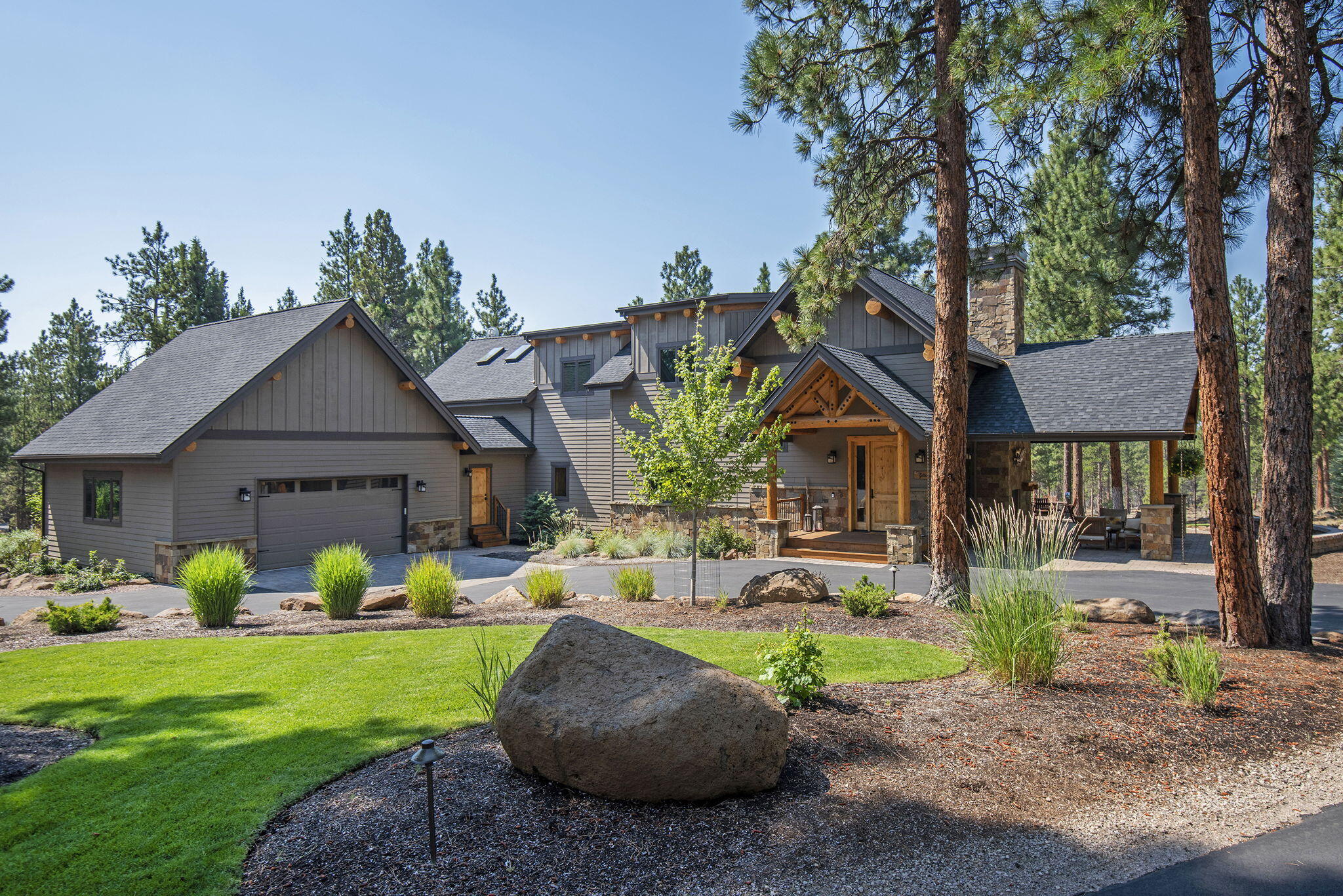 A custom built, luxury oasis in the pine trees. Revel in end of road privacy as you take in the views from this stunning, staggered beam constructed home with luxury finishes. Home thoughtfully features local artists' custom work: Zeitner glass light fixtures/ Skip Armstrong carvings. Dining/kitchen/primary wing all have 12 ft ceilings. Main level primary with spa like bath has access to deck, hot tub and views. Upstairs features 2 bedrooms, 1.5 baths, flex area (could be gym, studio, etc). Lounging loft area w/balcony, wet bar and more views! Covered outdoor entertainment area with fireplace, tv hook up, and extensive decking. Paved, circular drive. Custom, glass greenhouse w/raised planting beds. RV garage with power/water/dump. HOA includes access to trails, picnic area and Wychus Cr.