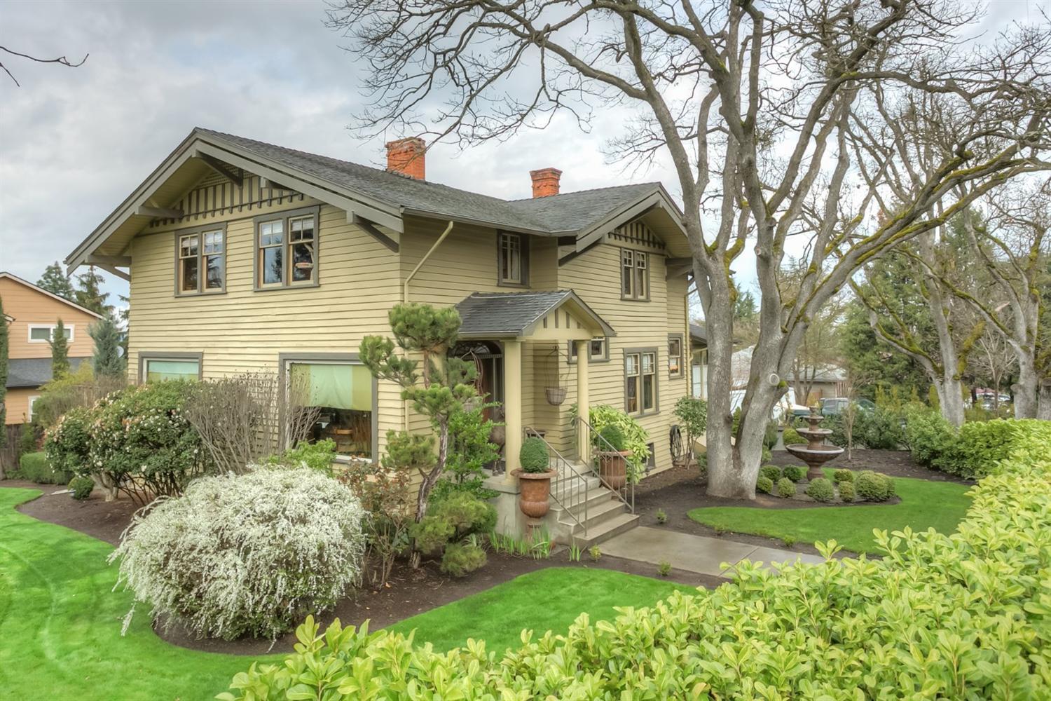 Old school craftsman charm and character on the edge of Old East Medford. Old world woodwork starting w/the grand entry door w/glass transom, wood floors, base molding, crown molding, wainscoting, wood wrapped windows/doors, wood/glass int. doors w/lead caming, antique handle sets/knobs/latches, antique fixtures/some modernized recessed lighting w/dimmers and of course a claw foot tub. Every room is large and features its own theme w/custom color schemes, decorative ceilings, wall coverings, large windows/terrific views f/upstairs. Kitchen is delightful w/antique tile counters/backsplash, beaded copper sink, large free floating island, gas range/oven, microwave and additional side room for supplies/pantry space. Breakfast nook is located off kitchen w/large windows and lots of light. Formal dining area is spacious and can be closed off from the kitchen. Elegant parlor style living room, marble style fireplace and connects to patio. Huge full basement. 2 car gar. Mature landscaping.
