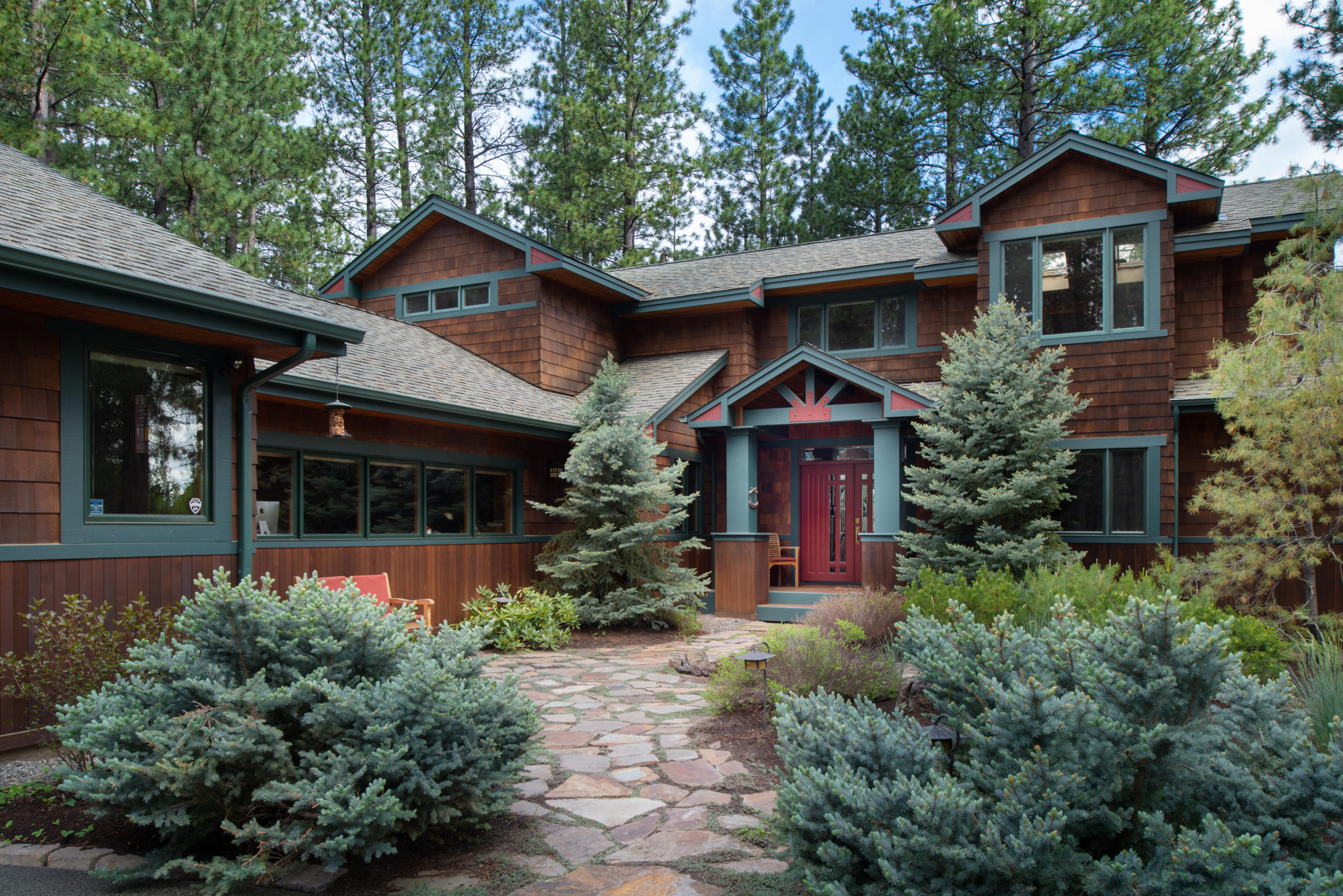 The ultimate Oregon experience. Nestled in amongst mature Ponderosa pine trees on the banks of Spring River this custom home is the image of Central Oregon living. The great room features a beautiful river rock/double sided fireplace for cozy winter evenings or brisk summer mornings and enjoys the perfect space for a puzzle table. The kitchen features recent updates with cherry and hickory cabinets and Oak hardwood flooring with a dining nook and high end appliances including a 4 burner gas cook top and an over-sized pantry. The master suite is truly spacious with fireplace and sitting area and great views. The large loft space upstairs is perfect for a game of pool or sit and get caught up on your reading. Enjoy the back deck as it overlooks the river or walk down the path to hop in a kayak. High quality features through out. A must see!