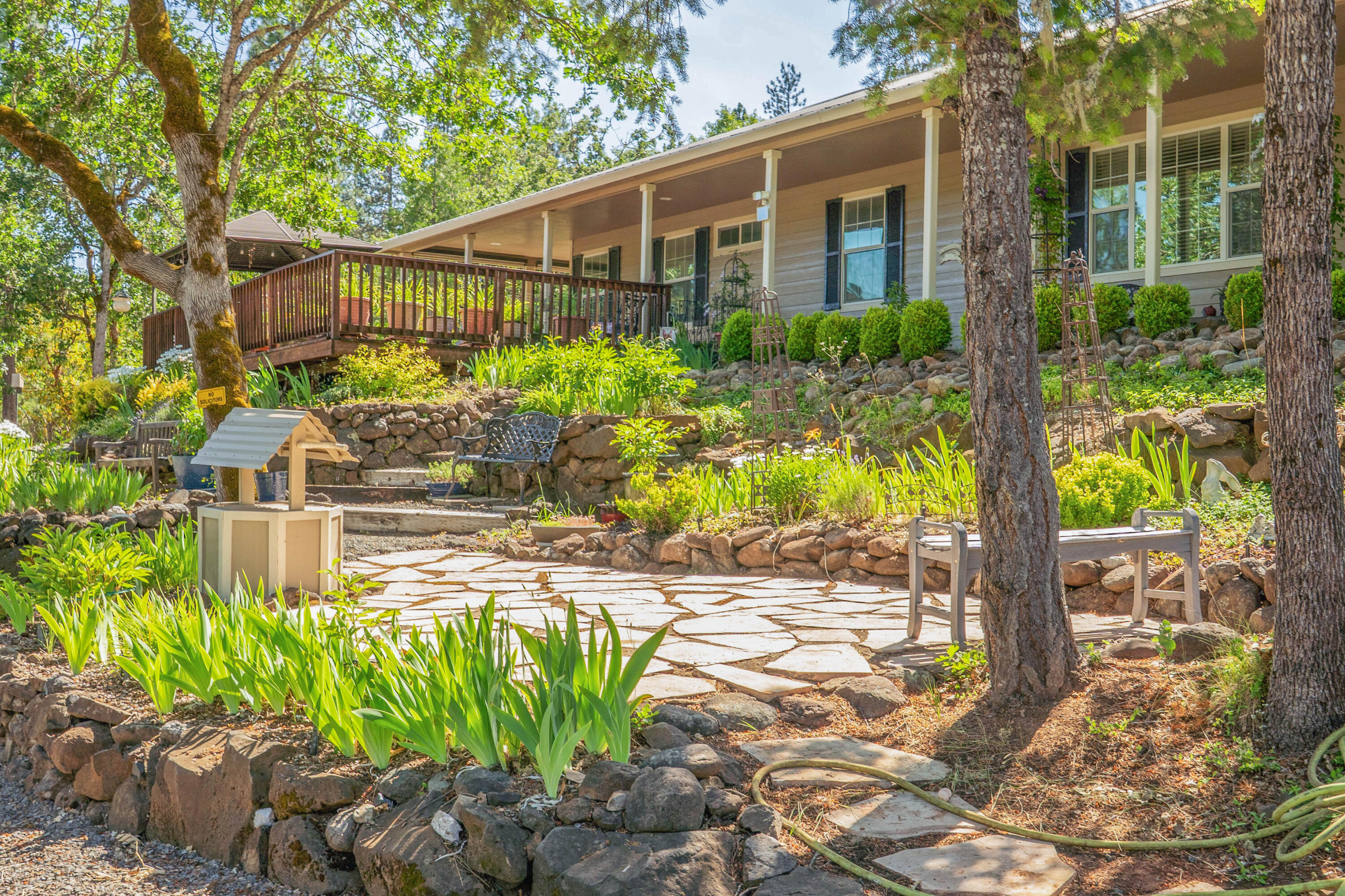 Welcome to this beautifully updated 3-bed, 2-bath ranch on 5 serene acres in Trail, Oregon. Enjoy a durable metal roof, fresh exterior paint, granite counters with reverse osmosis, and a spacious primary suite with a renovated walk-in closet, jetted tub, and separate shower. Firewise landscaping, Hardie Board siding, multiple sheds, and garden areas enhance the property. The large, permitted detached 2-car garage provides ample storage or workspace. Unwind by the seasonal pond—just minutes from Shady Cove and the Rogue River, with easy access to Ashland and Jacksonville.