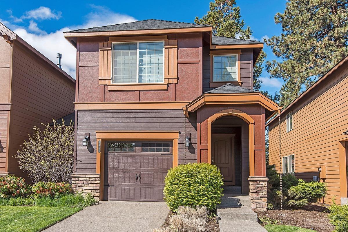 This quality Pahlisch built townhome is located in NW Bend in Empire Estates and it's conveniently located to shopping, restaurants, the Deschutes River, Sawyer Park, and Riley's Ranch. Nicely finished with hardwood floors, stainless steel appliances, and tile countertops. Recent improvements include new garage door, new carpet, new interior, paint, and several upgrades to the kitchen. Great room floor plan with gas fireplace in the living room; all bedrooms, laundry, room, and office nook with built-in cabinets upstairs; spacious primary suite has ample storage including walk-in closet; gas forced air heat and central air conditioning. Oversize attached single car garage has extra room for storage or workbench. The only common wall between this townhome and the neighboring town home is the garage bumpout wall. Fenced backyard with deck