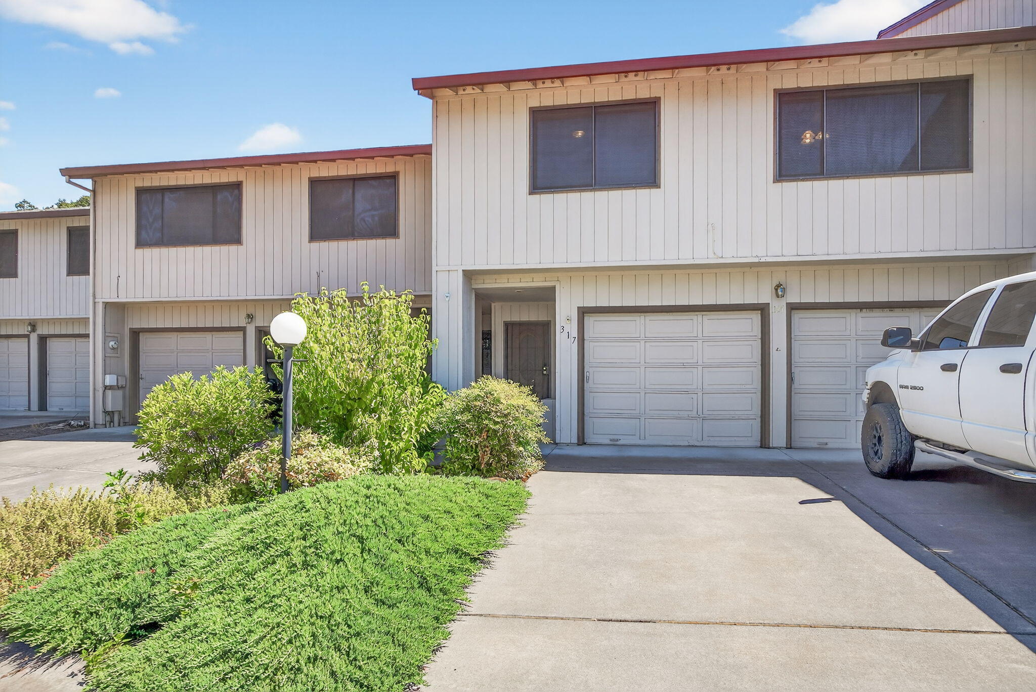 This is a charming townhome in a great East Medford location. It is a spacious 1616 square feet, with two bedrooms, two bathrooms, and a wonderful open floorplan. There are vaulted ceilings, all new carpet, paint and hardware throughout! A wonderfully updated kitchen with stainless appliances, tile backsplash, gas range/oven and wonderful espresso bar. The 
living room and dining room open out to the covered deck and low maintenance back yard. The primary bedroom also has vaulted ceilings with a large walk-in closet, and large 
primary bathroom with dual sinks. The second bedroom has a convenient Murphy Bed, that easily doubles as a spacious office with a great view. There is an oversized two car garage, and lots of storage. In addition, there is great pool, clubhouse, and a beautiful common area with a convenient visitor parking area. Easy to show!