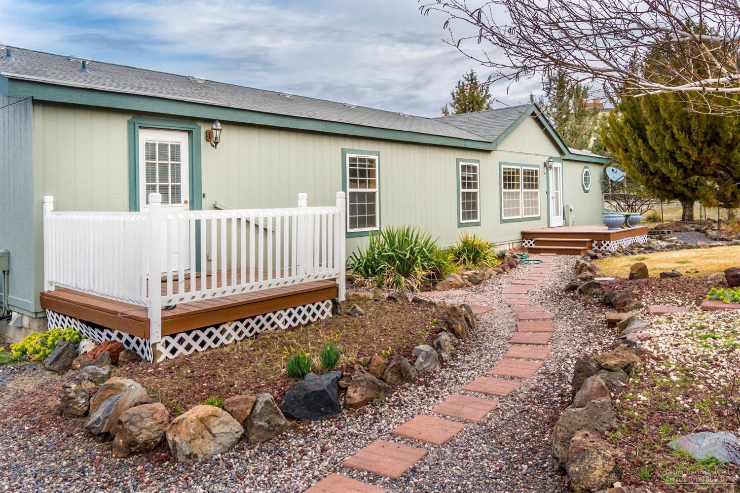 This outstanding Good Cents home has quality features, including vaulted ceilings, a large master suite, kitchen island, full wall pantry, laminate flooring, newer carpet, slate, tile, heat pump, extensive decking, double-garage, storage room, shop and large storage building. This 1.25-acre lot adjoins a 90-acre community pasture with 2-mile walking track. The many windows along the back of the home provide wide open views of Cascade Mountains. Home is ready for you to make it your own!