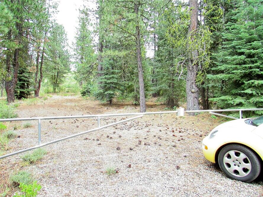 Located in Klamath Forrest Estates, about 3 miles off Hwy. 140 on the well maintained North Kingfisher Road is this 3 plus acres.  This is a nice wooded parcel, level to gradually sloping that has been completely fenced by Bowers Fencing to include a locked entry gate.  A culvert and driveway have been constructed at the entrance for easy access.  Power ids at Kingfisher. This is remote but not too remote.  Homes are sparcely scattered throughout the areas.  This is a beautiful quiet area, what a great place to build your new home and raise some critters.