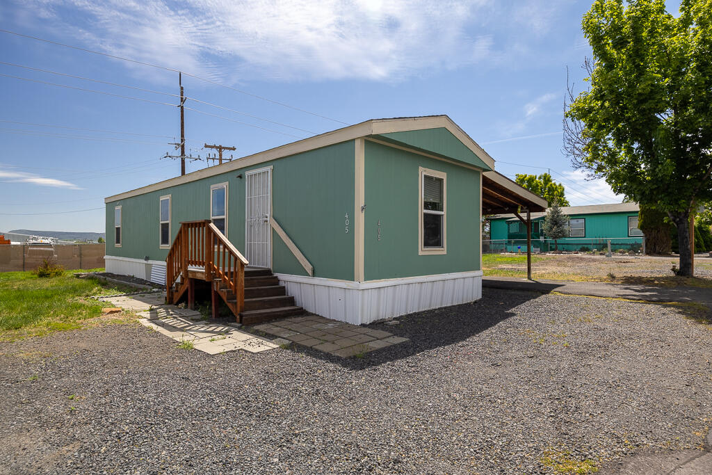 Welcome to this cute and cozy 2 bedroom 1 bathroom manufactured home. Sitting on a rare double lot, this home offers extra space for gardening, relaxing, or entertaining. There are 2 storage sheds, a fenced yard, and plenty of parking. Inside you will find a bright and cheerful living area, a functional kitchen, and two comfortable bedrooms. This home is the perfect blend of comfort and affordability for anyone seeking low-maintenance living in a quiet community.