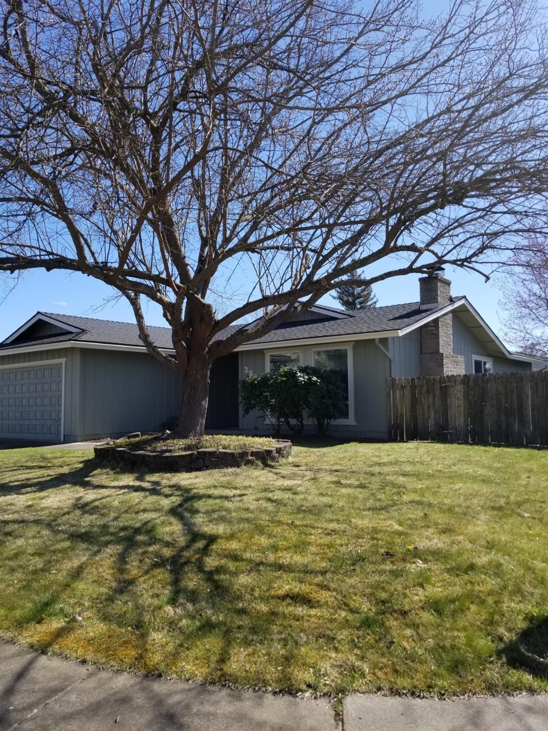 This is a move in ready, single level East Medford home with a large fenced back yard and rv parking. The interior and exterior of home were just painted and new carpet was installed. The living room has a beautiful floor to ceiling stone fireplace and vaulted wood ceiling. The patio is large and covered.