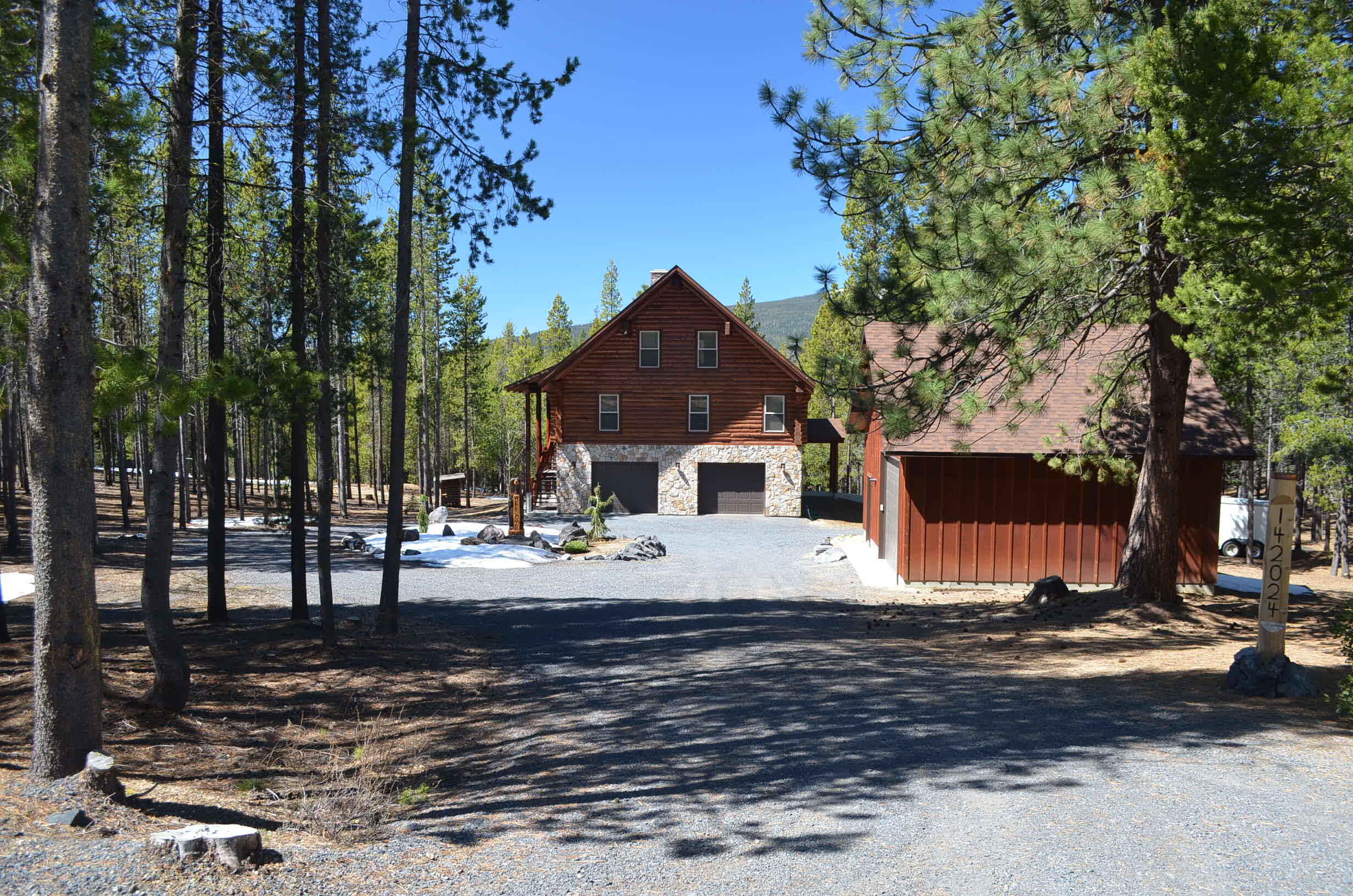 Custom built, lodge styled, log cabin in the desirable Diamond Peaks area.  Located near Willamette Pass Ski Resort, Pacific Crest Trail, Odell and Crescent Lakes.  Enjoy all the outdoor activities the area has.  Skiing, hiking, snowmobiling, fishing, boating to name a few.  Home features floor to ceiling windows, heated floors, open floor plan with large kitchen, dining and living areas on the mail floor along with two bedrooms.  Upstairs there are two additional bedrooms and a loft sitting area.  Downstairs you will find an additional living room, along with utility room and access to the insulated garage.  Three door garage allows for parking two cars, a tractor and snowmobiles/ATVs plus there is a second garage/shop.  This home would make a beautiful full-time residence, vacation home with plenty of room to brings friends and family, or vacation rental property.  Property consists of two one and a quarter acre lots, circular driveway, and full RV hookup.
