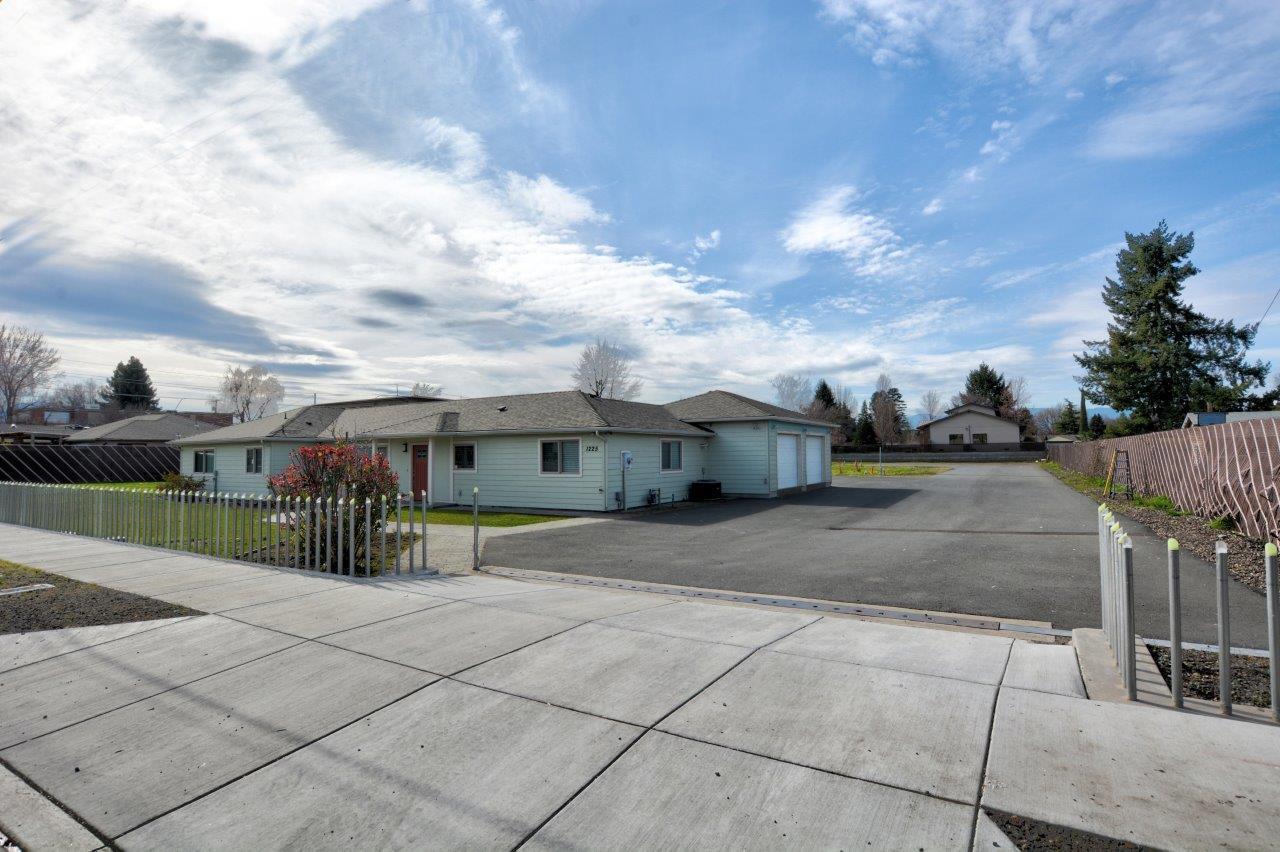 This multifaceted property is located near Medford's highest population density neighborhood, Medford's sprouting financial district, and is situated about 200 feet from the Providence Medford Medical Center campus. A multitude of options are open with this luxury VRBO home on its own tax lot AND ALSO 3 additional, empty and individually sellable tax lots, all included for one price! Commercial zoning has already extended from McAndrews down Corona Avenue and the land currently abuts commercially zoned properties. Seller states that development of 32 units or a four story medical campus may be the highest and best use. Instant income is possible with its current VRBO, Airbnb, luxury rental set up with contemporary styling, custom concrete floors and fully updated throughout. Buyer to do their own due diligence on all aspects of use.