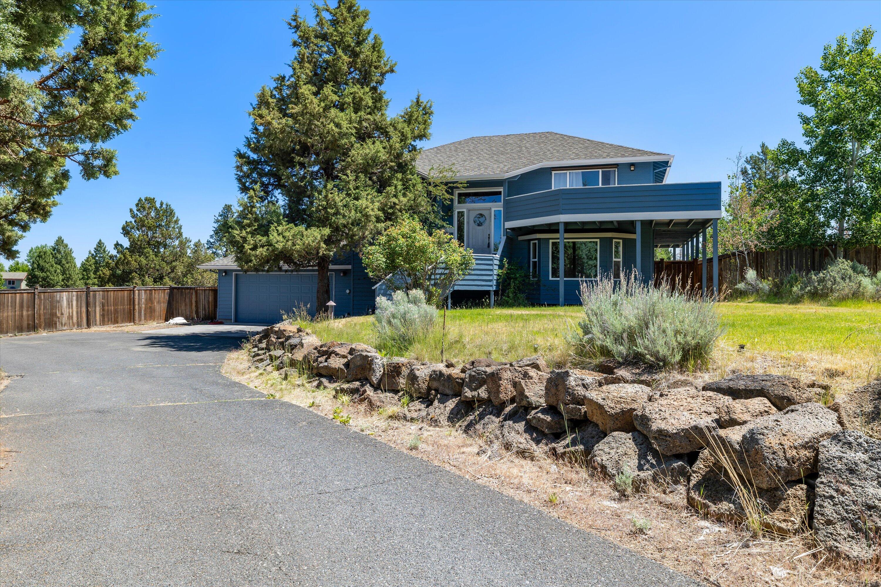 Located on a quiet cul-de-sac this 4-bedroom + Office, 2.5-bath home sits on a spacious .74-acre lot with mountain views, offering peaceful living with recent improvements including a newer roof, fresh exterior paint, new carpets, and updated kitchen appliances (refrigerator, range, and dishwasher). The functional split-level layout features an open-concept living room, kitchen, and dining area, with the primary suite upstairs, complete with an ensuite bath and walk-in closet. Downstairs, you'll find three additional bedrooms, a full bath, laundry room, bonus room and a versatile office/den. Enjoy the expansive deck overlooking the fully fenced backyard and mountain views, perfect for evening sunsets. RV parking adds extra convenience. Don't miss out on this incredible opportunity for peaceful living with easy access to everything Bend has to offer!